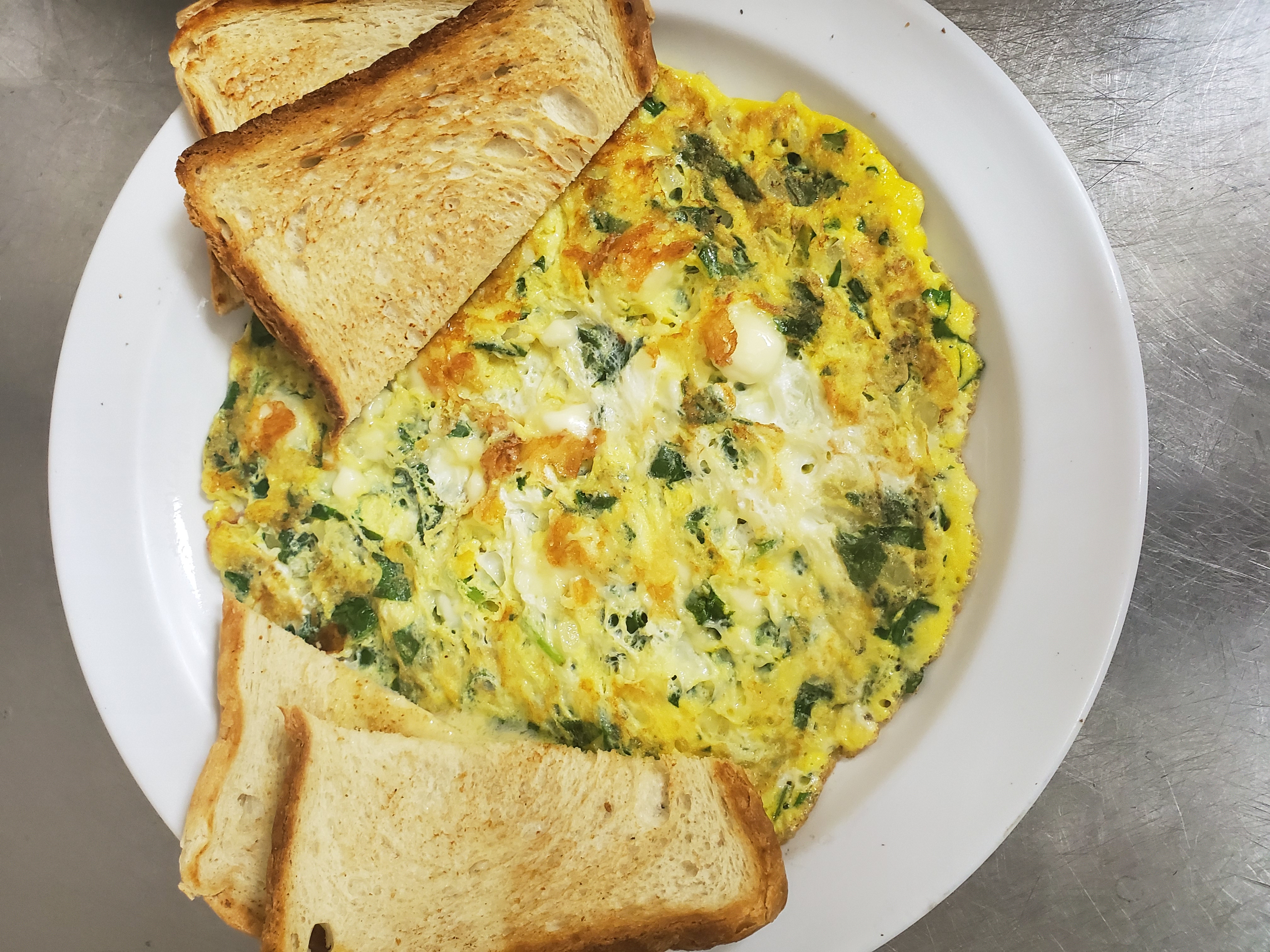 Order Spinach & feta omelette food online from Aminas Cafe store, Bronx on bringmethat.com