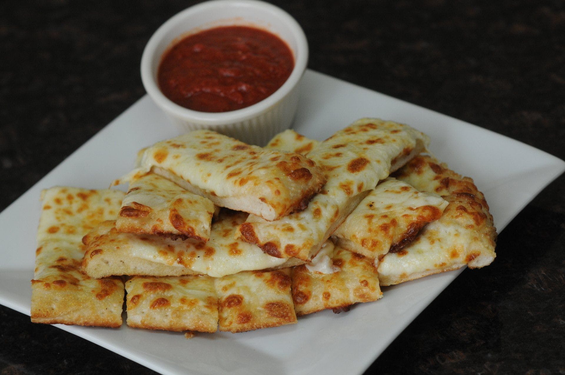 Order Cheese Sticks - 12 Pieces food online from Stosh Pizza store, Center Line on bringmethat.com