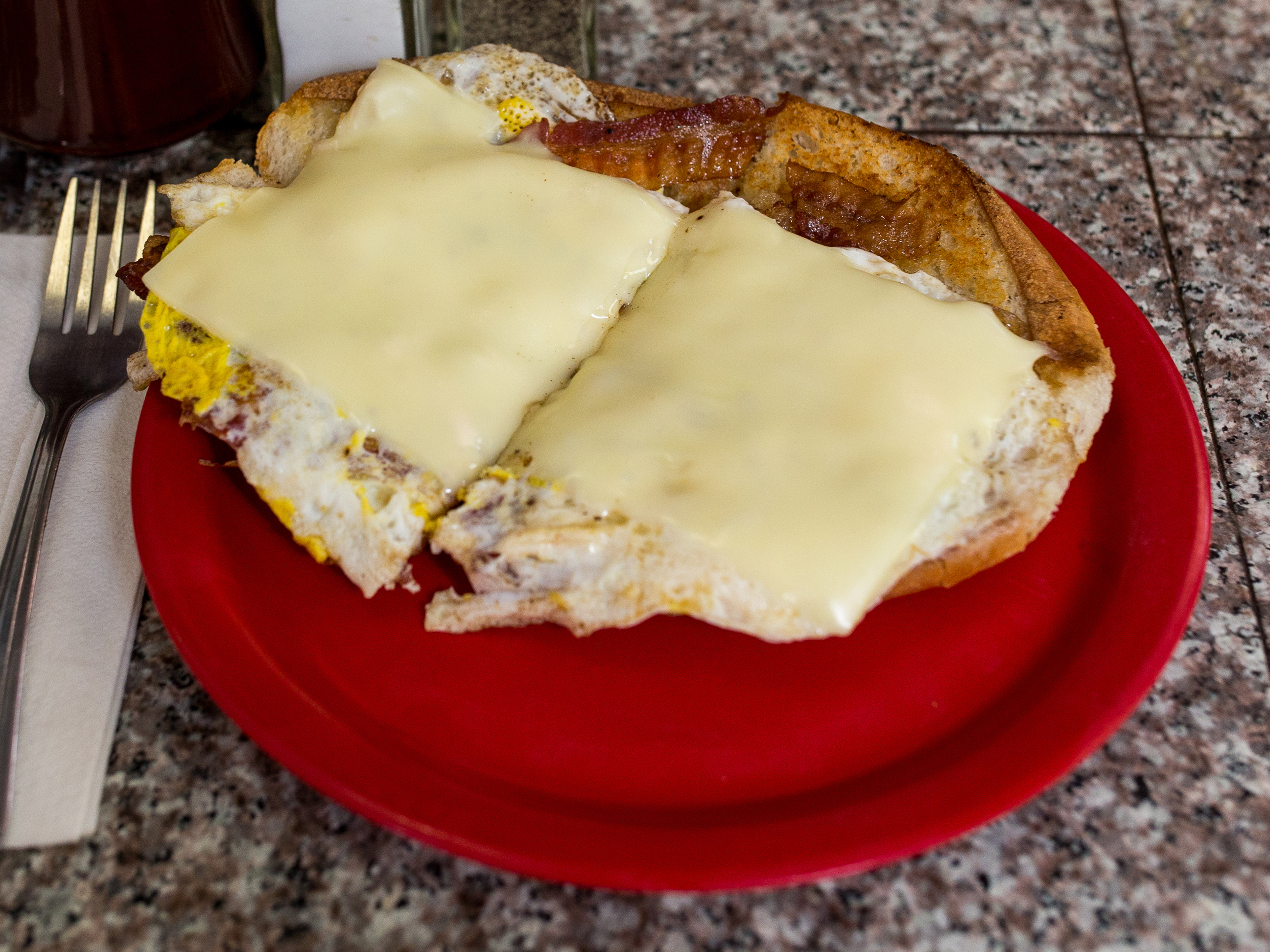 Order Bacon, Ham, Sausage Egg and Cheese Breakfast Sandwich food online from Louis Family Restaurant store, Providence on bringmethat.com