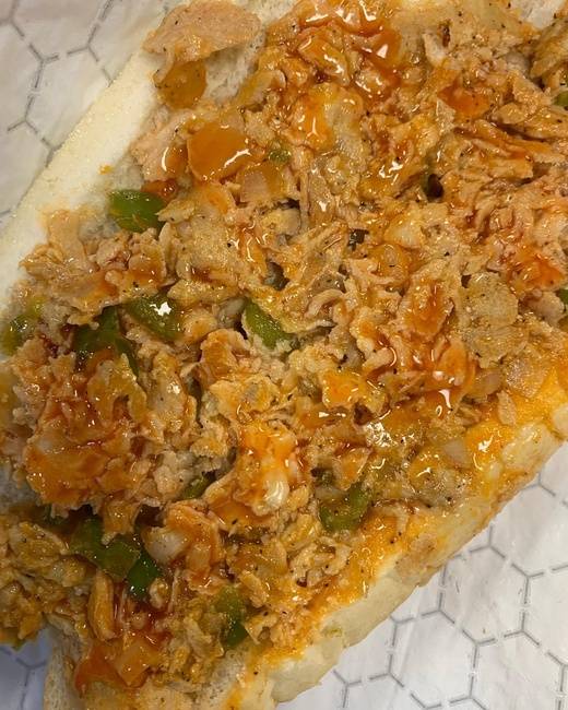 Order Buffalo Chicken Philly Cheesesteak with peppers onions and buffalo sauce (9oz of meat on a  Amoroso roll food online from From Philly To Charlit store, Charlotte on bringmethat.com
