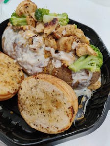 Order Alfredo Loaded Potato with Two Protein food online from The Food Station store, Toledo on bringmethat.com