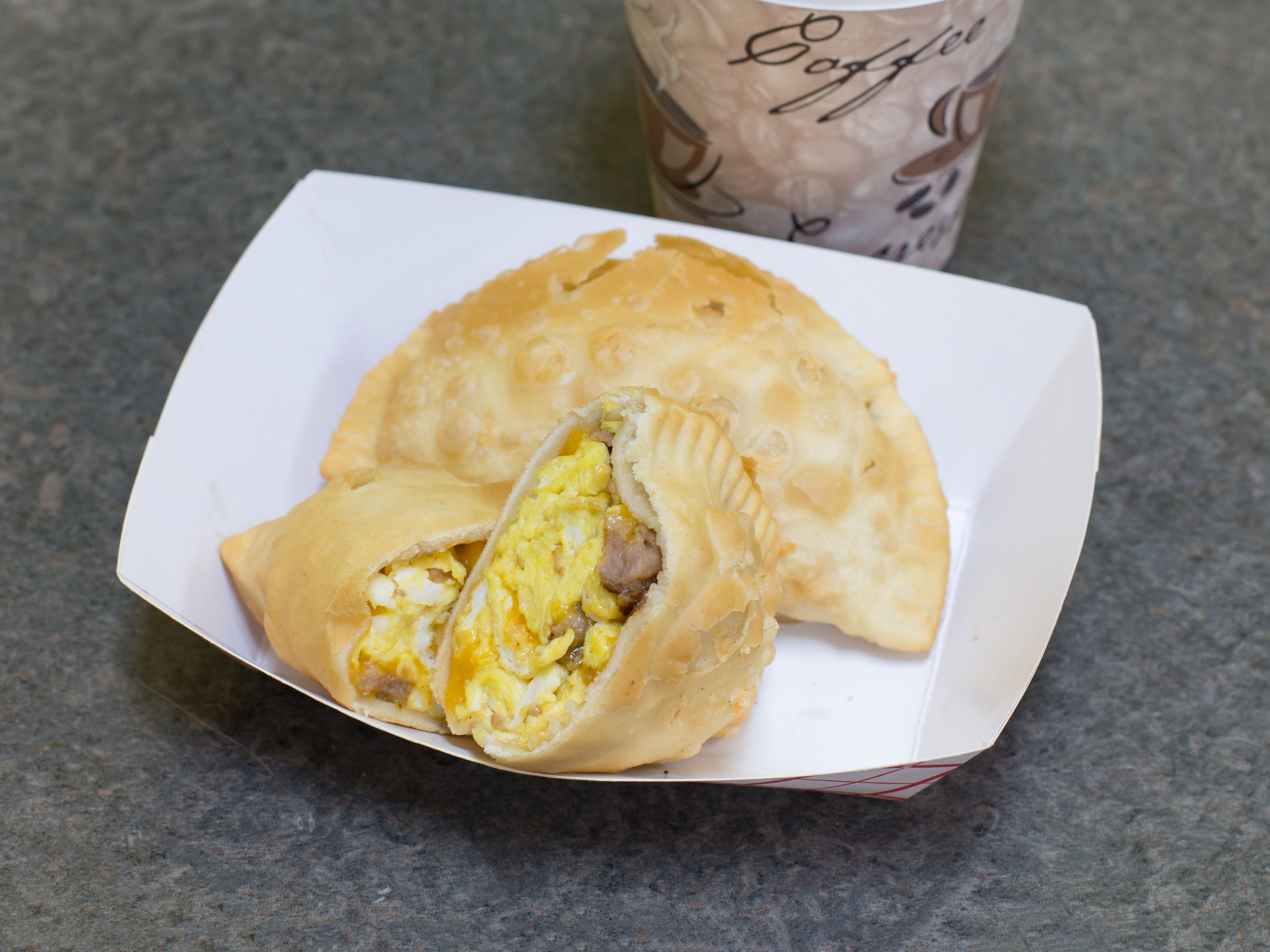 Order 2 Empanadas and a Small Coffee Breakfast food online from Gourmet Express Market store, Hawthorne on bringmethat.com