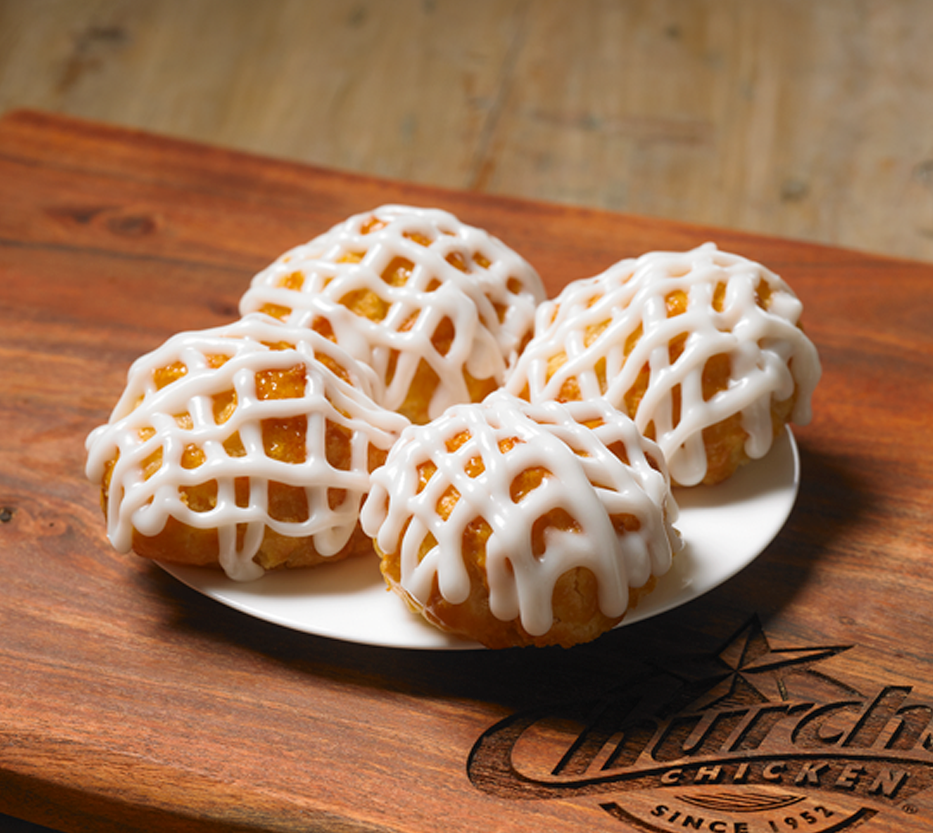 Order 4 Frosted Honey-Butter Biscuits™ food online from Church Chicken store, El Centro on bringmethat.com