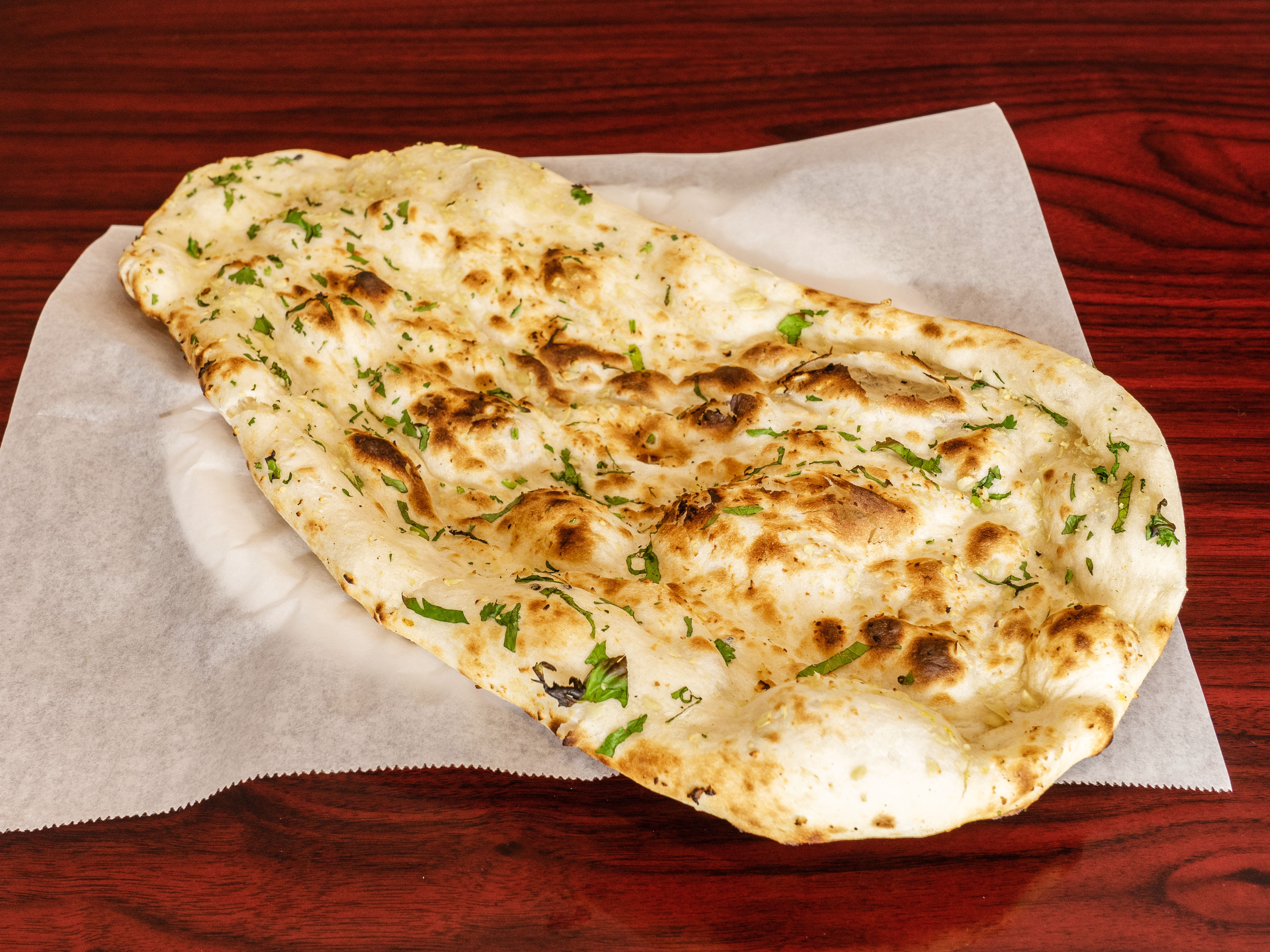 Order Garlic Naan food online from Indian Curry Cuisine store, Irvine on bringmethat.com