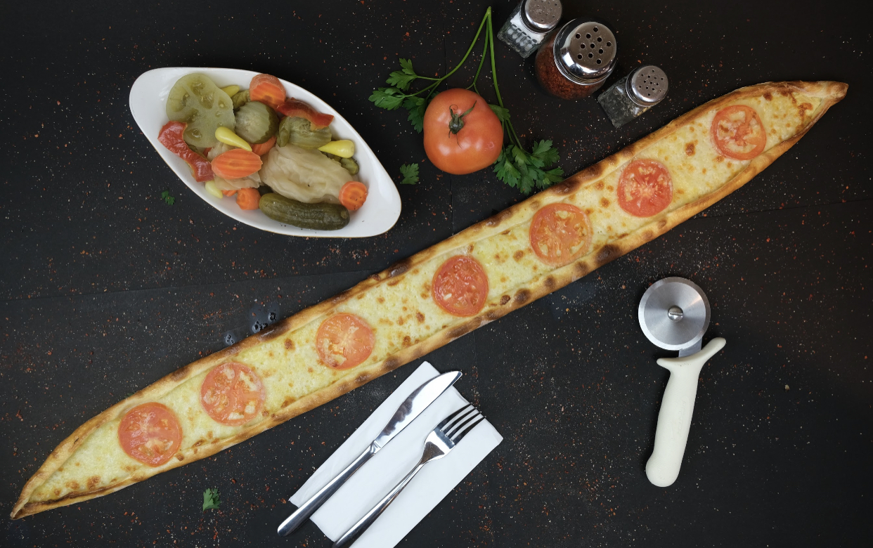 Order Mozzarella and Tomato Pide food online from Pide Lahmajoun store, Cliffside Park on bringmethat.com