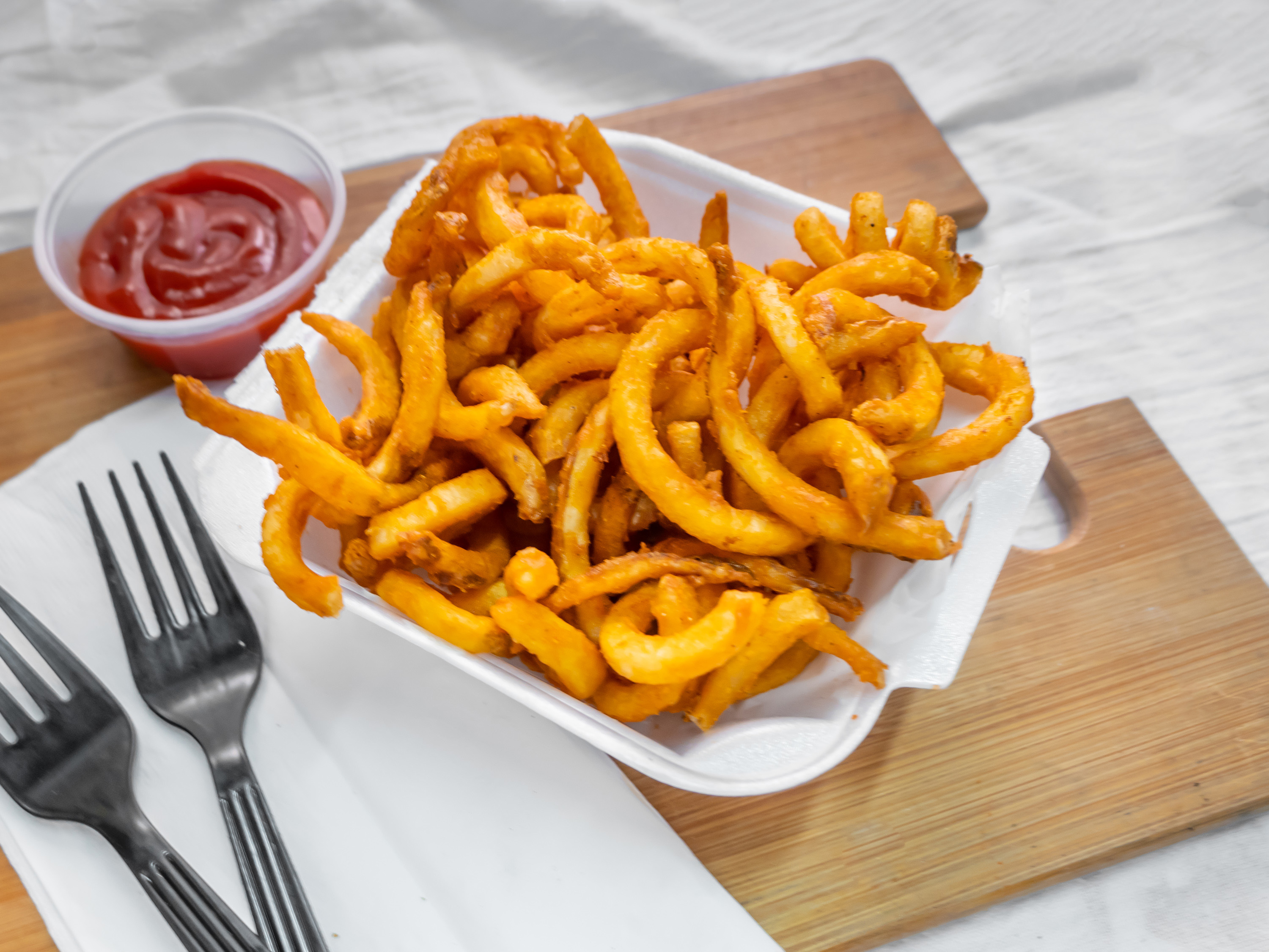 Order Seasoned Curly Fries food online from Not Just Pizza - South Philly store, Philadelphia on bringmethat.com