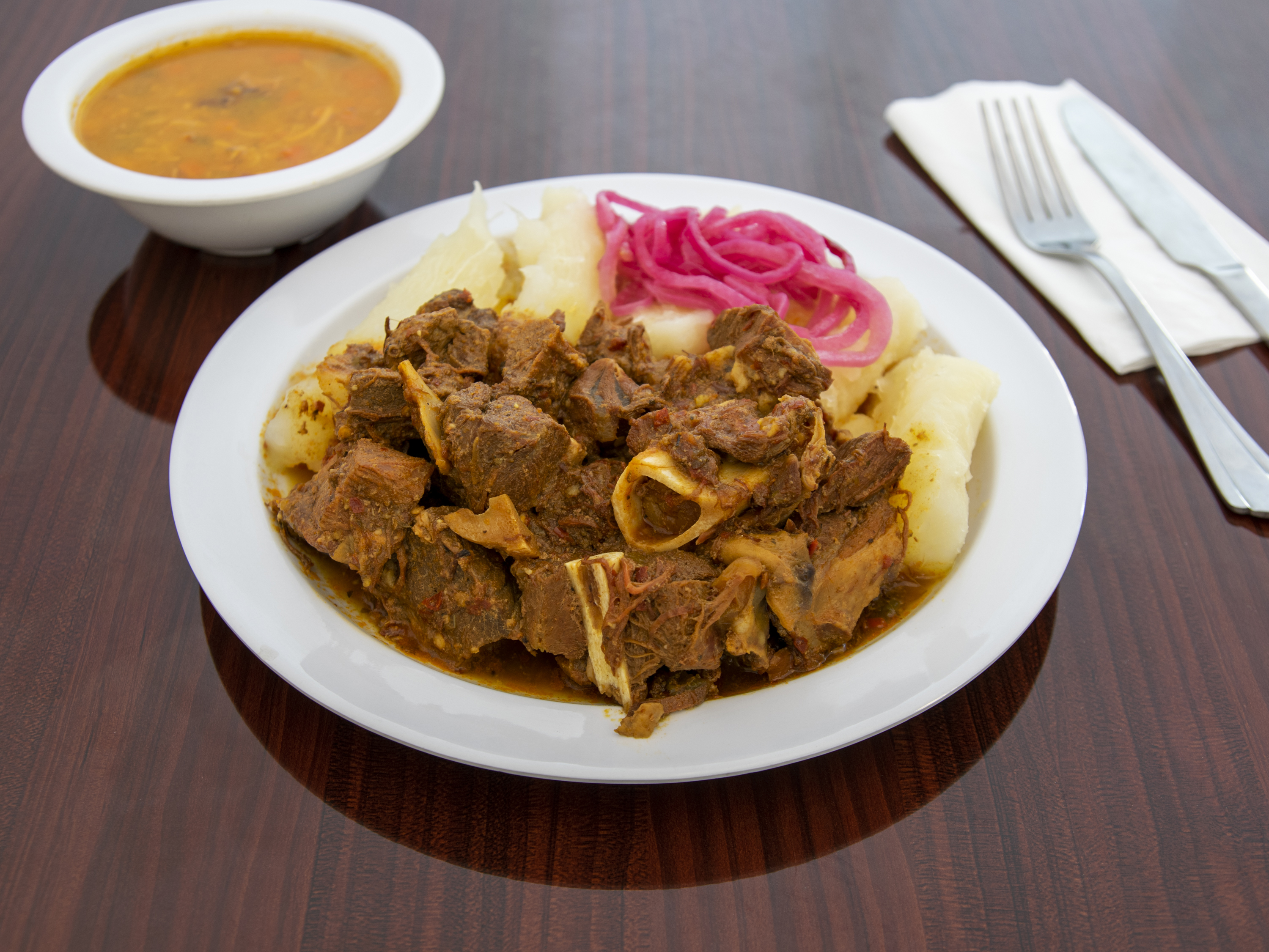 Order Goat Stew / Chivo Guisado food online from Banquet Restaurant store, Elizabeth on bringmethat.com