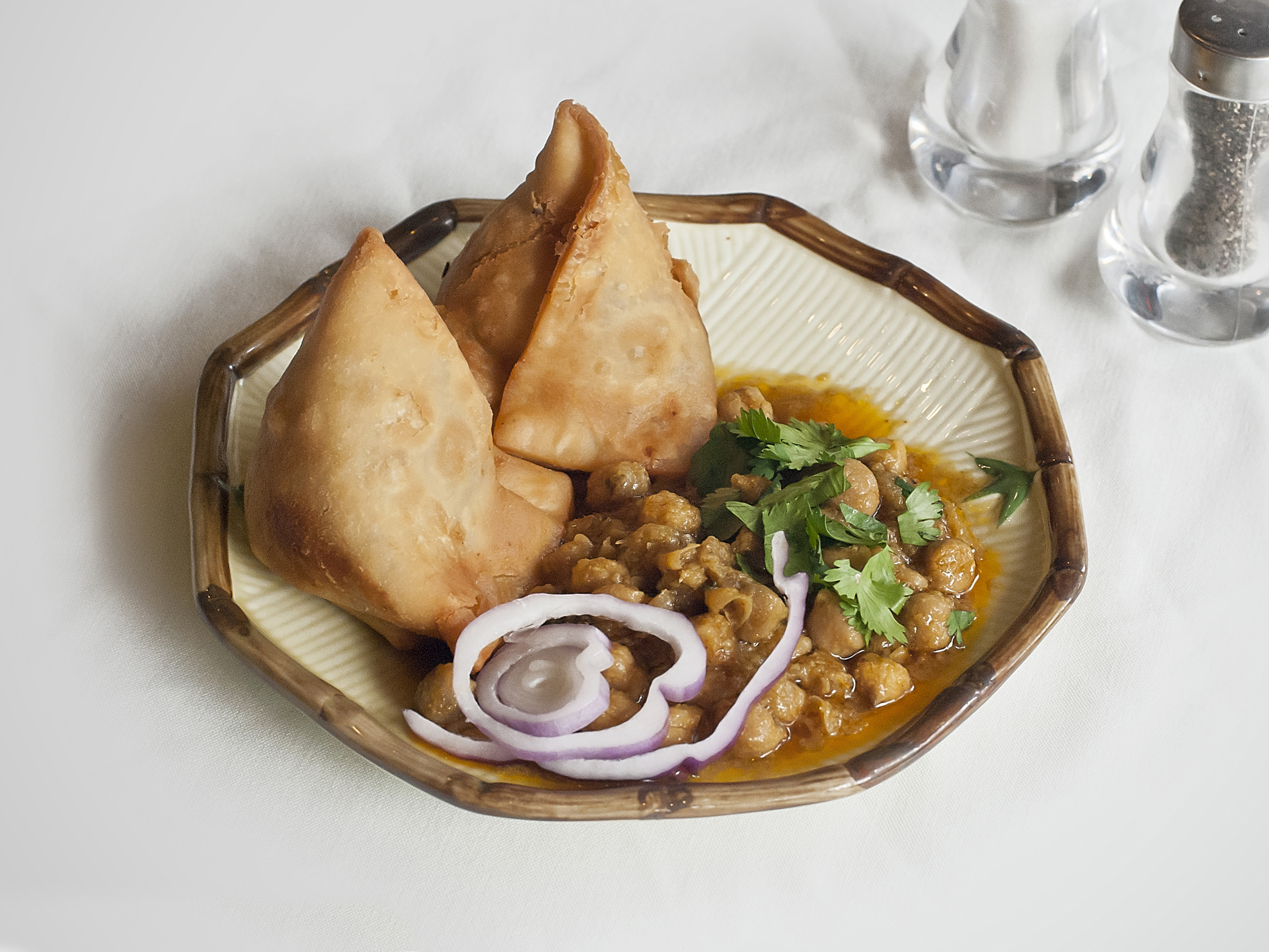 Order 2. Two Pieces Vegetable Samosa with Garbanzo food online from Biryani Tika Kabab store, Oakland on bringmethat.com