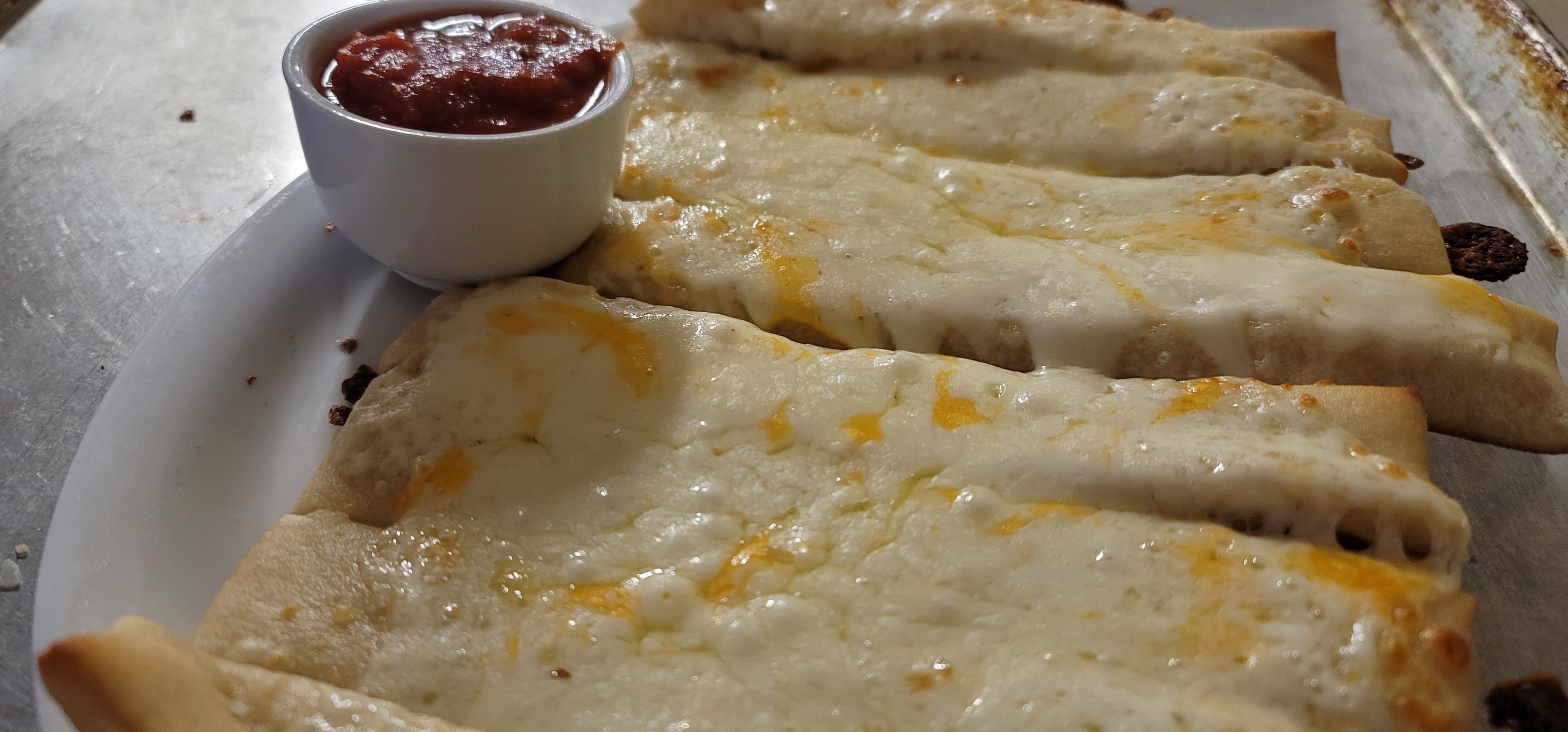 Order Cheesy Breadsticks - Appetizer food online from The Pizza Den store, Hoxie on bringmethat.com