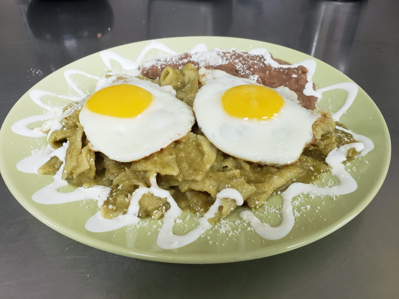 Order Chilaquiles food online from Aminas Cafe store, Bronx on bringmethat.com