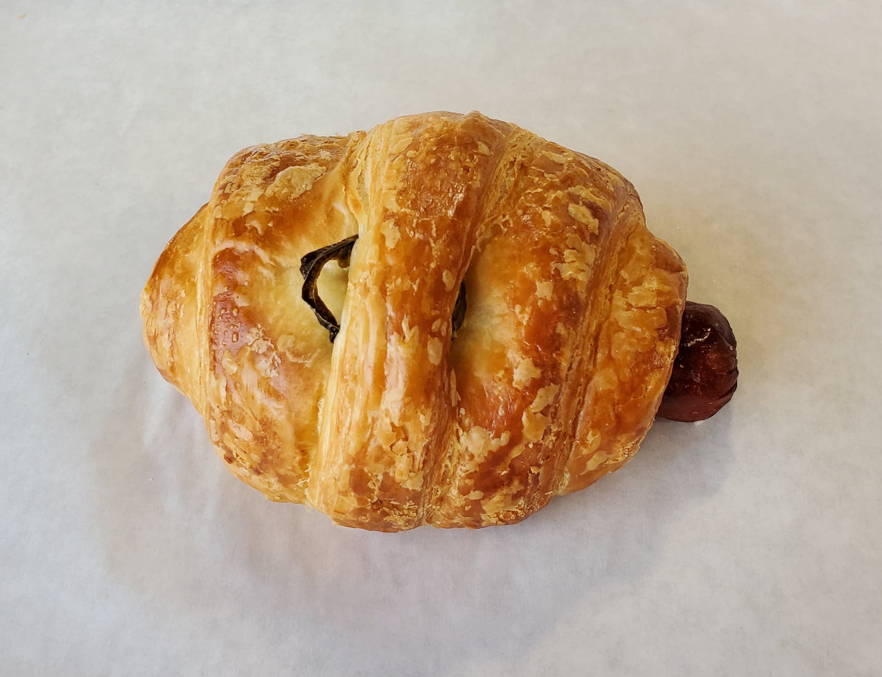 Order Small Sausage Roll Jalapeno Croissant food online from Honey Donuts store, Crowley on bringmethat.com
