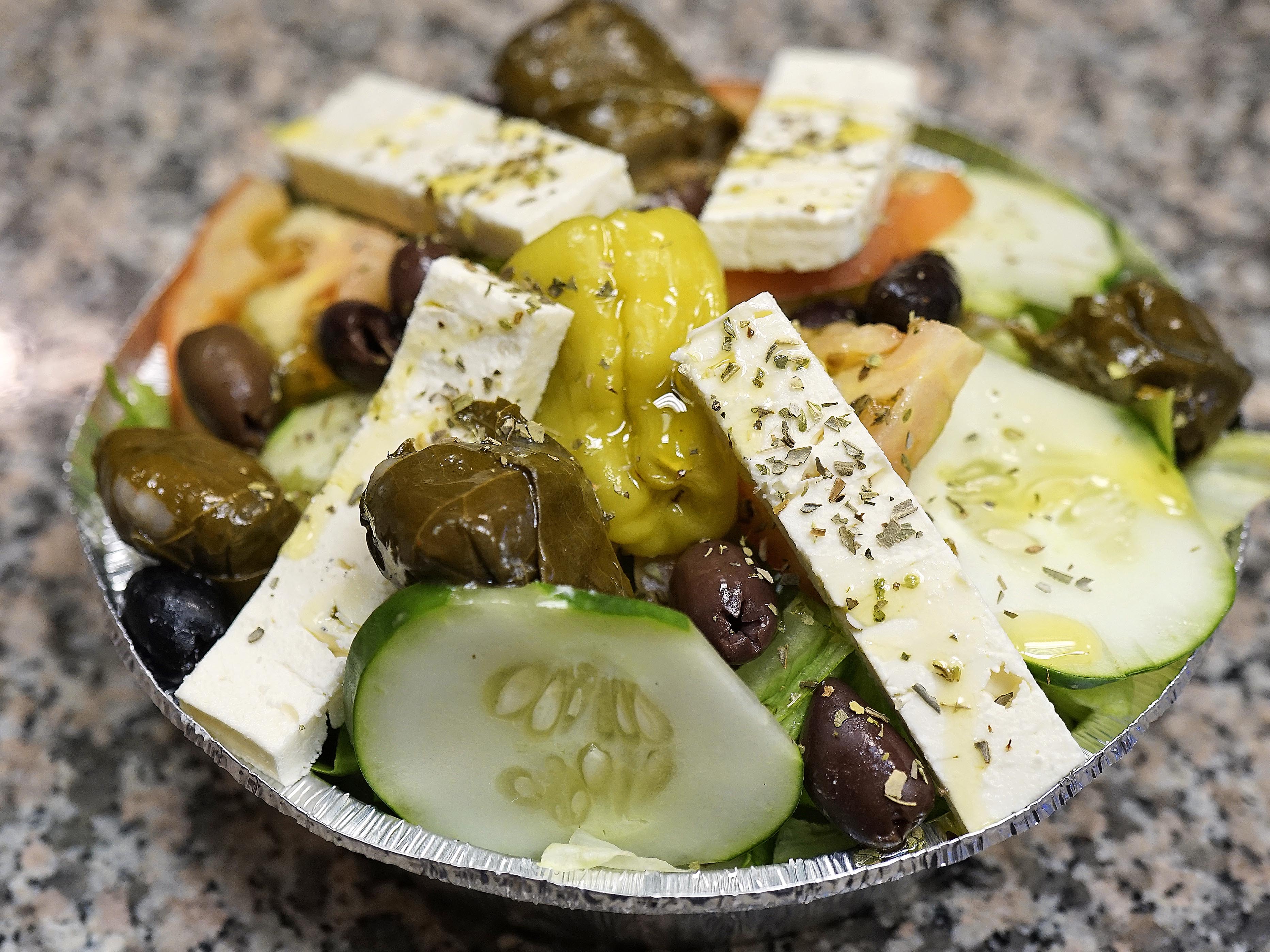 Order Greek Salad food online from Claudio Pizzeria store, New York on bringmethat.com