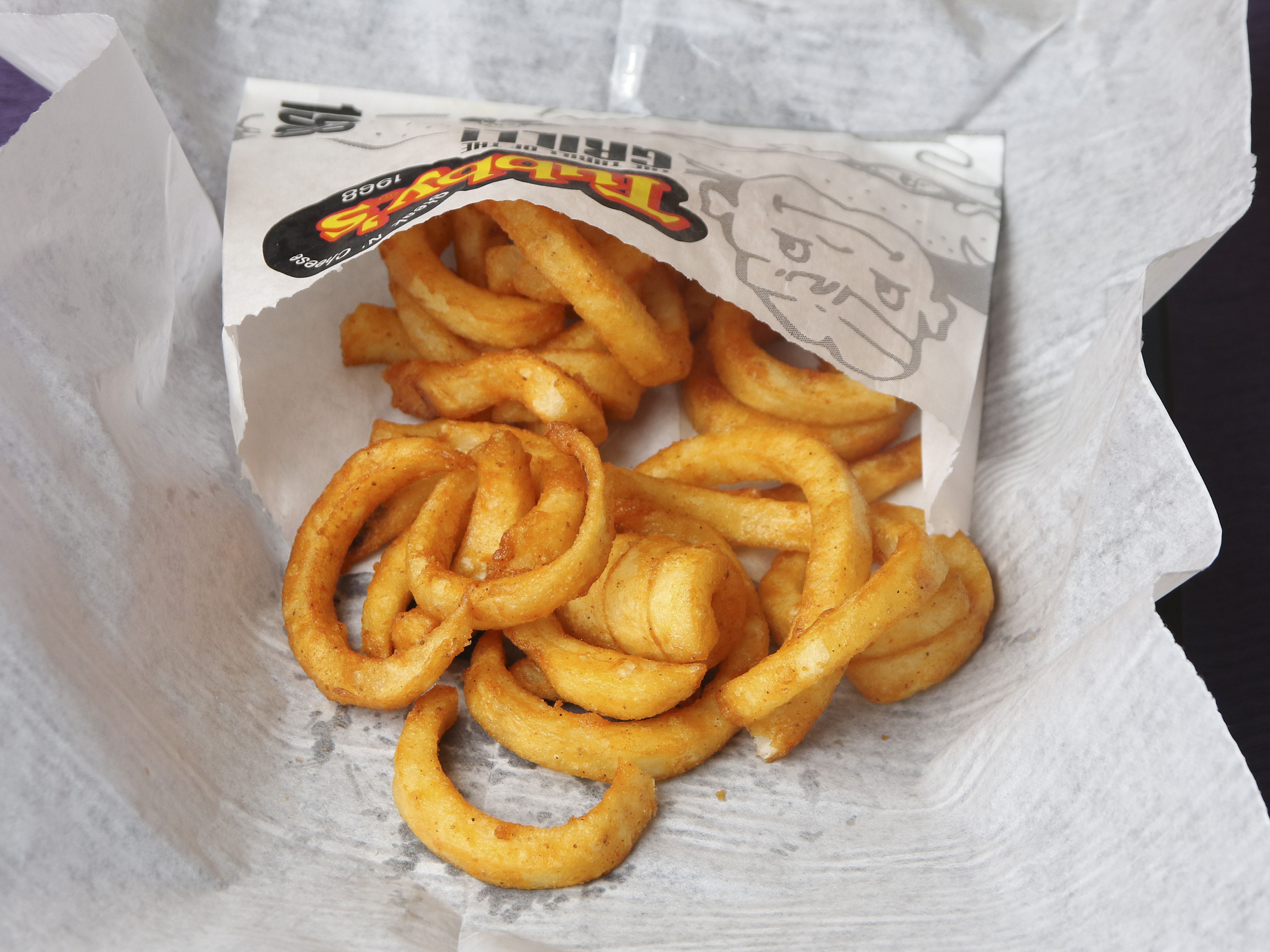 Order Seasoned Fries food online from Tubby's Grilled Submarines store, Sterling Heights on bringmethat.com