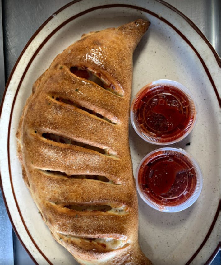 Order Calzone - Calzone food online from Mama's Pizza store, Fredericksburg on bringmethat.com