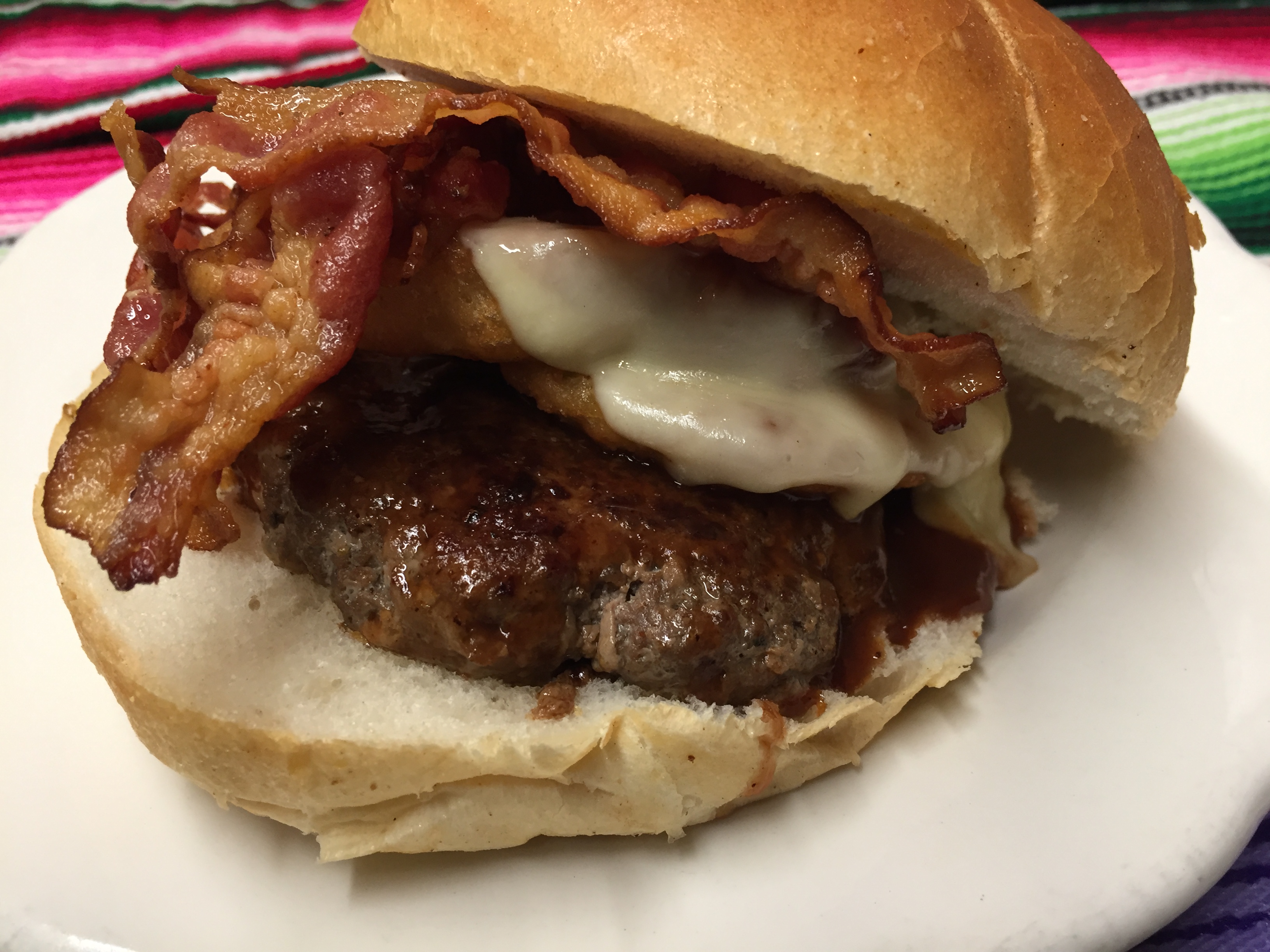 Order BBQ BACON PROVOLONE CHEESE AND ONION RINGS BURGER  food online from Montes Cafe store, Seaside Heights on bringmethat.com