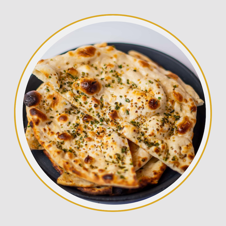 Order Chilli Garlic Naan food online from 5th Element store, Jacksonville on bringmethat.com