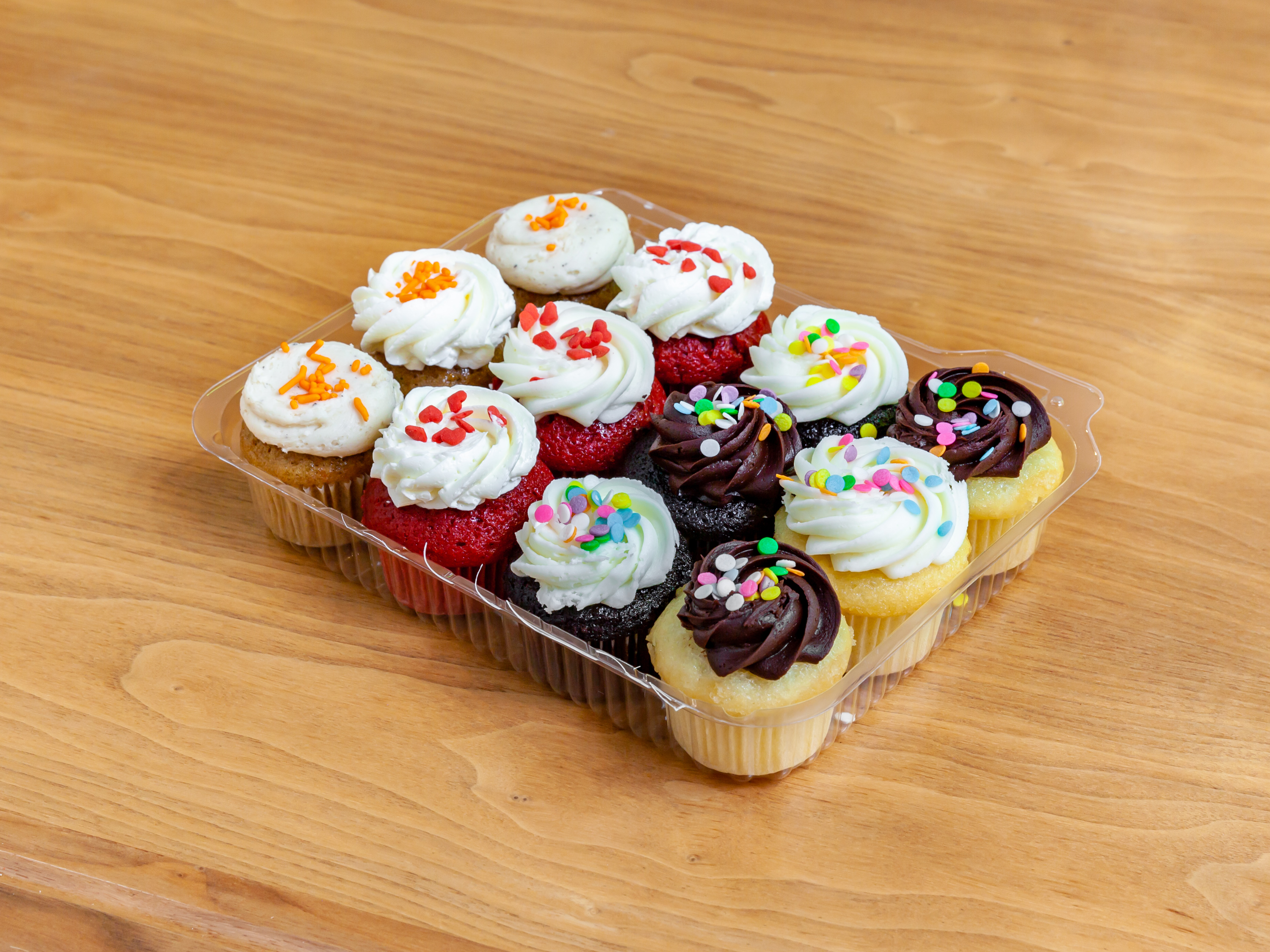 Order 1 Dozen Assorted Mini Molly Cupcakes food online from Molly's Cupcakes store, Chicago on bringmethat.com