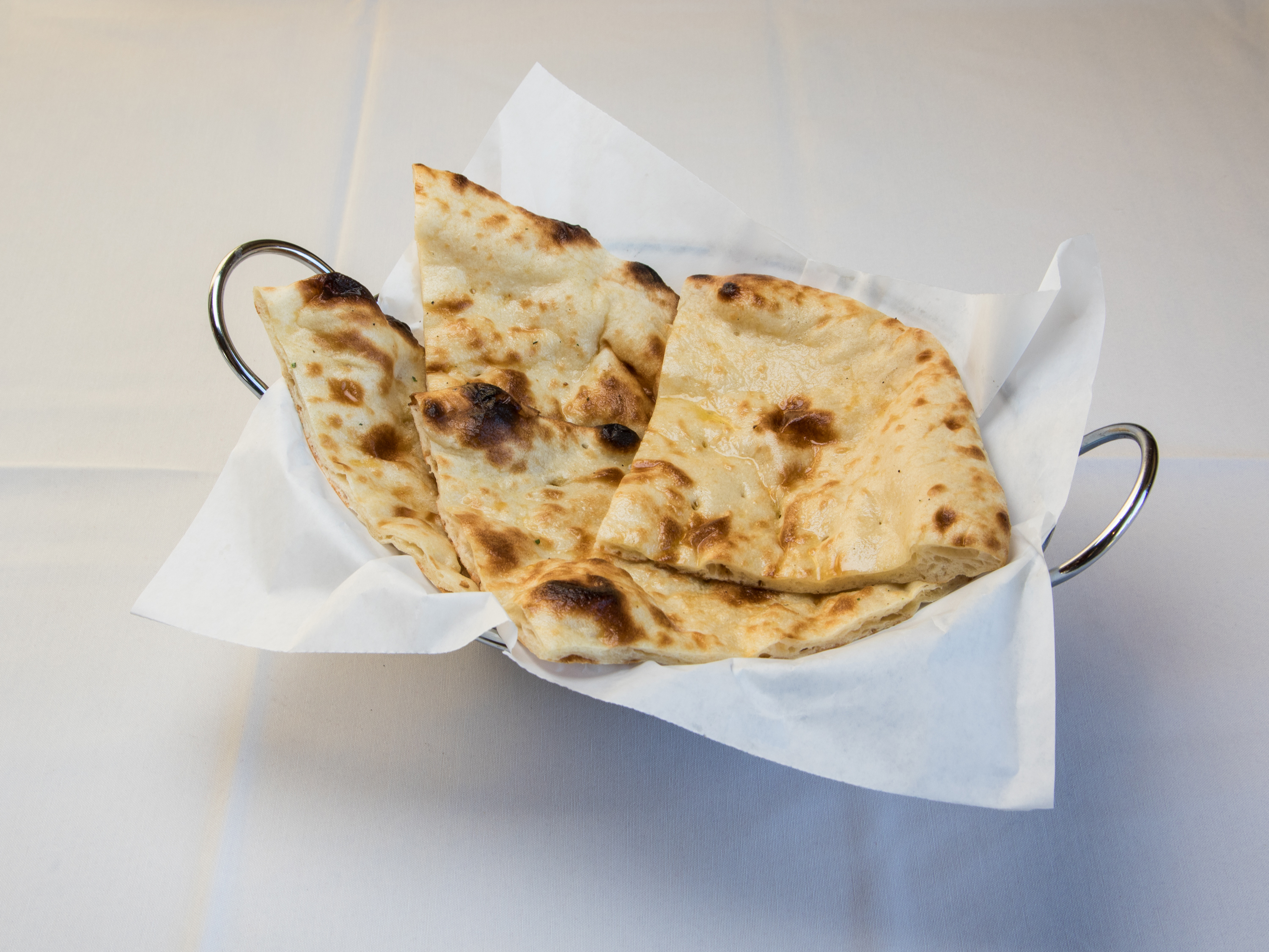 Order 8. Naan food online from Dhaba indian bistro store, Middleton on bringmethat.com
