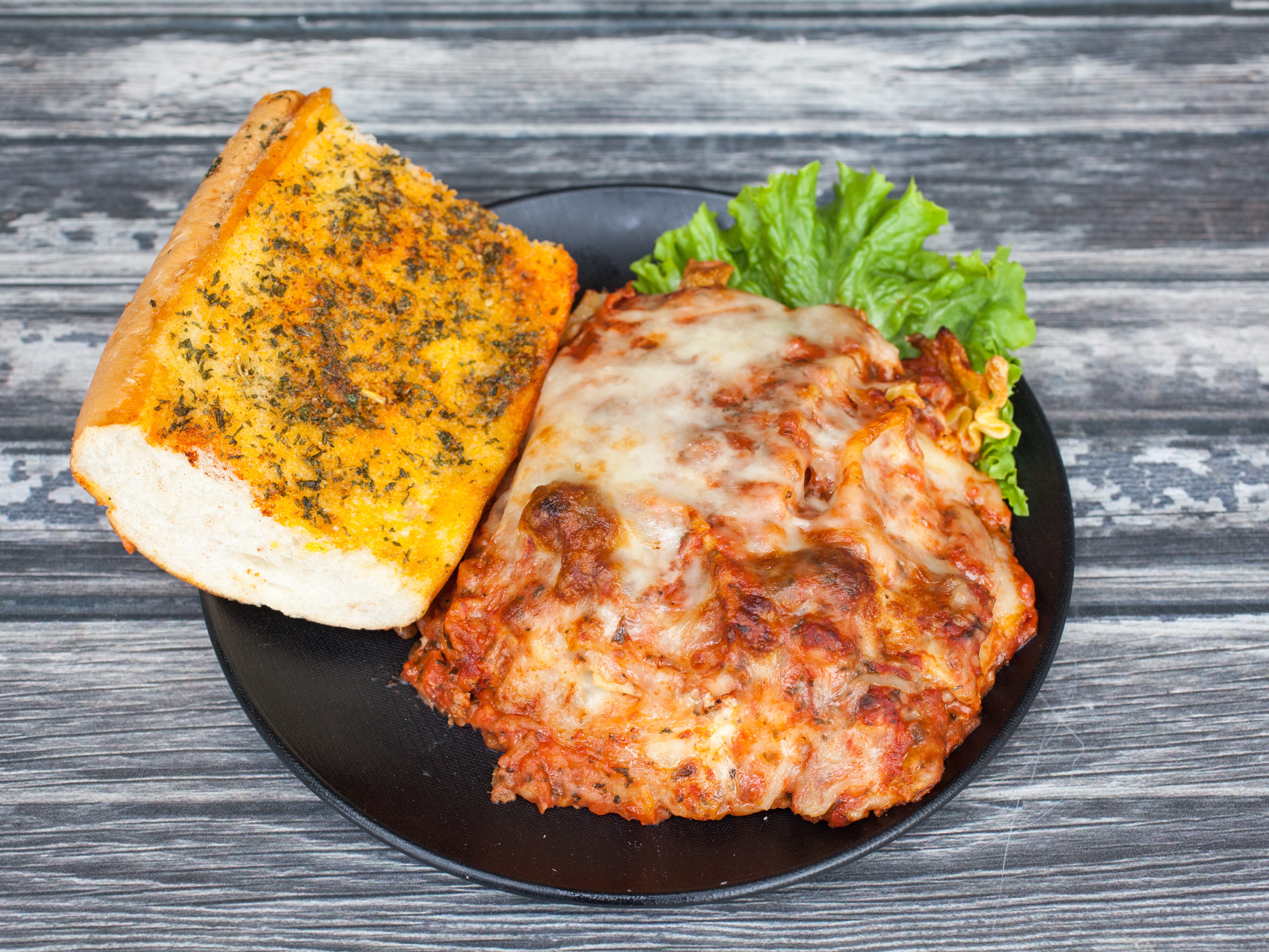 Order Meat Lasagna food online from Nicolinos Italian Restaurant store, Cathedral City on bringmethat.com