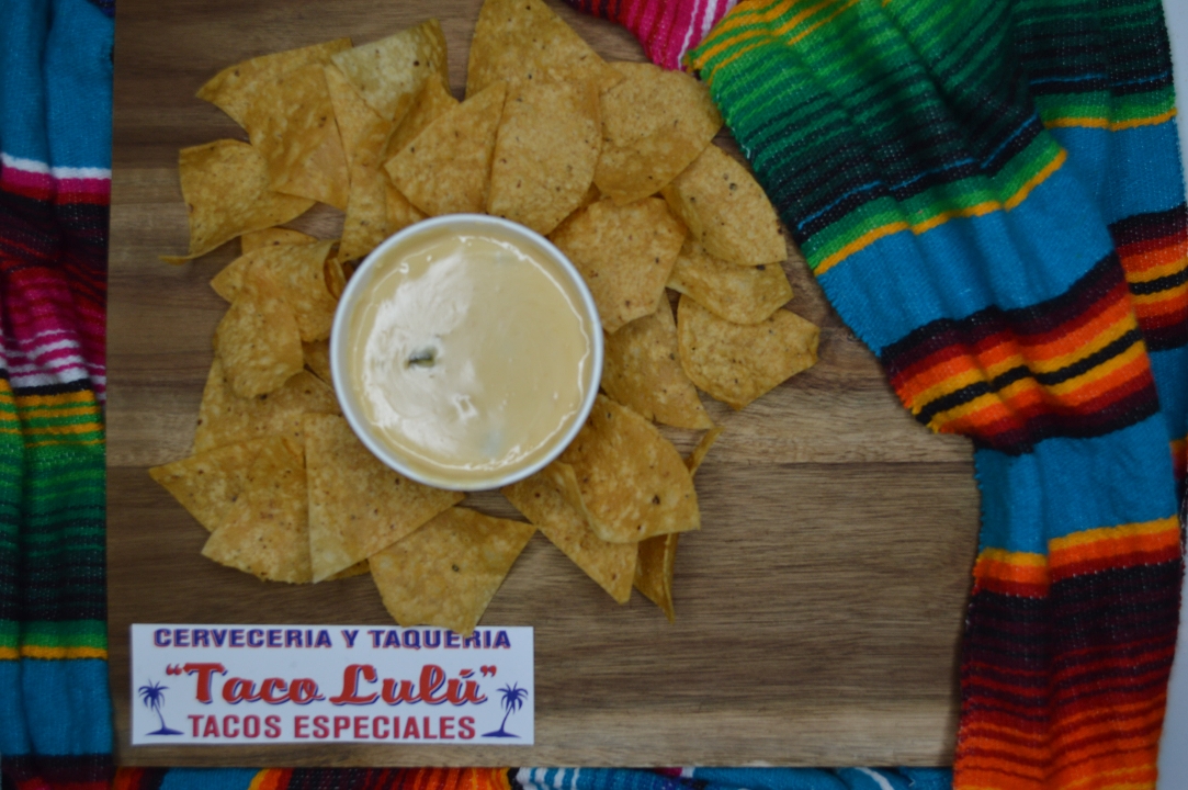 Order Chips and Home-made Queso food online from Taco Lulu store, Chicago on bringmethat.com