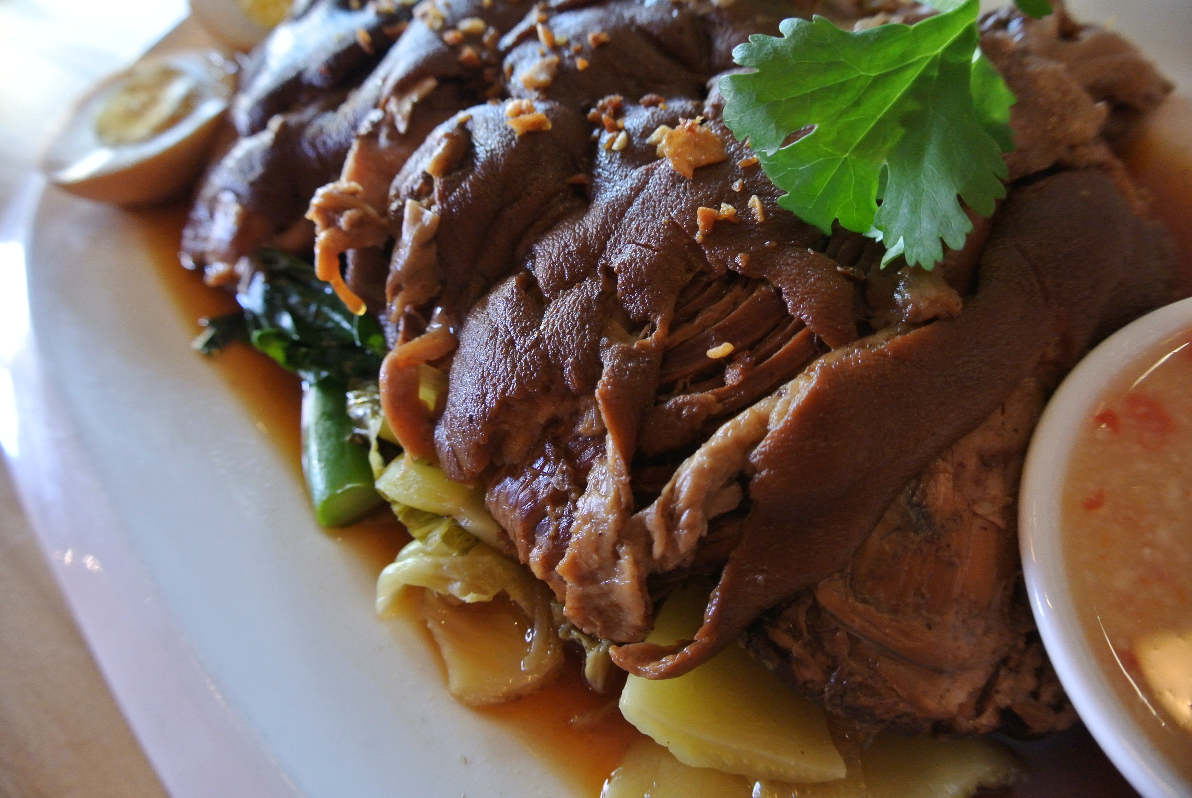 Order Stewed Pork Leg food online from Lers Ros Thai Noodles store, San Francisco on bringmethat.com