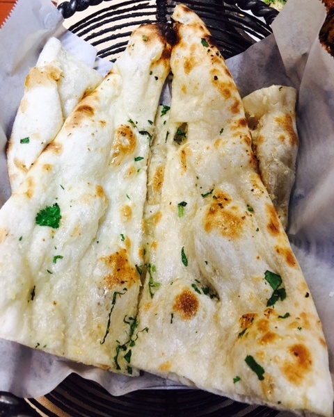 Order GARLIC NAAN food online from Indian Harvest store, Naperville on bringmethat.com