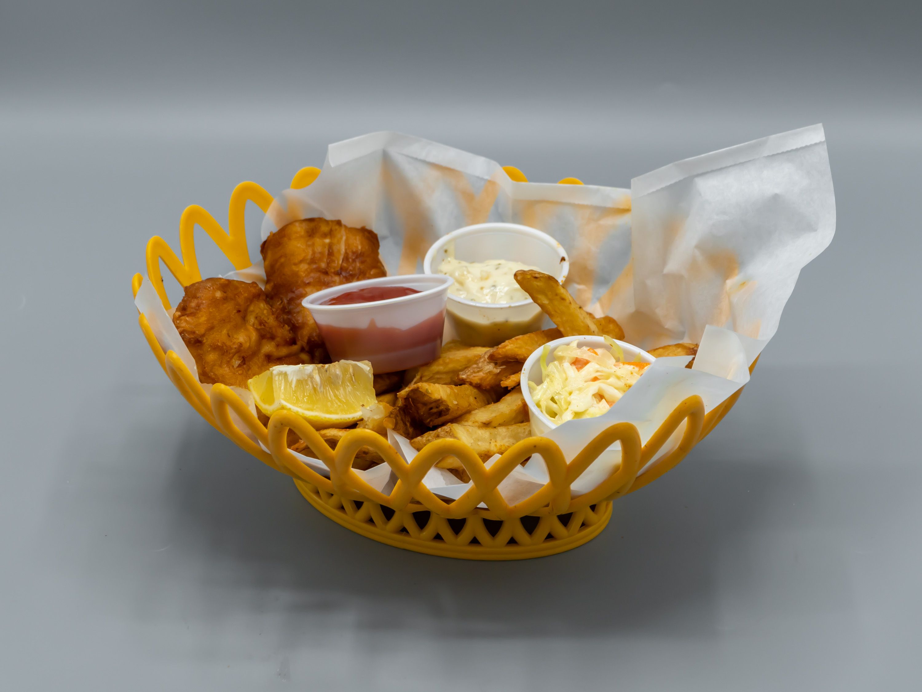Order Fish and Chips Basket food online from Freddie Beach Bar & Restaurant store, Arlington on bringmethat.com