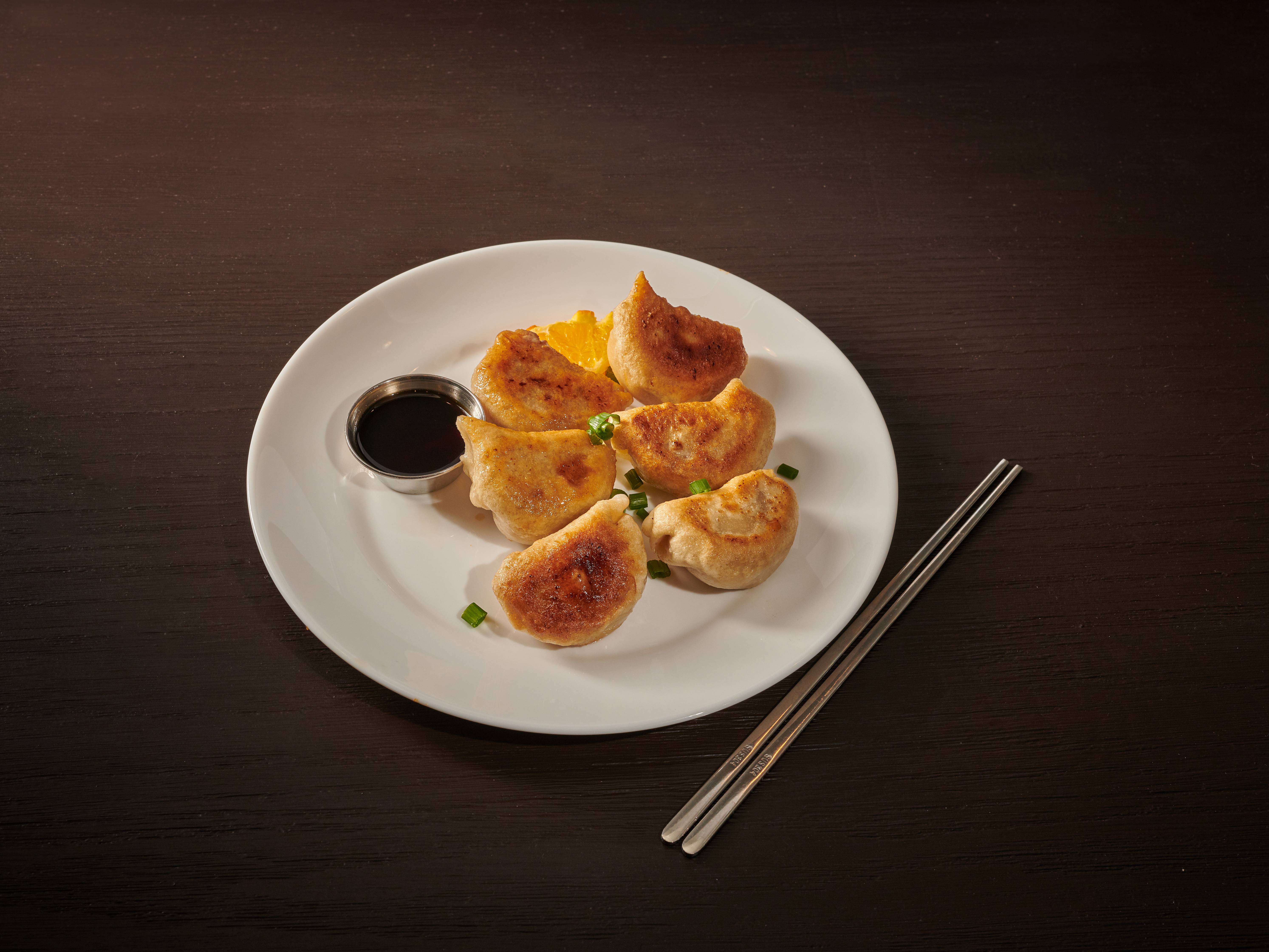 Order A16. 6 Piece Pan-Fried Pork Dumplings food online from House of Fortune store, Neptune City on bringmethat.com