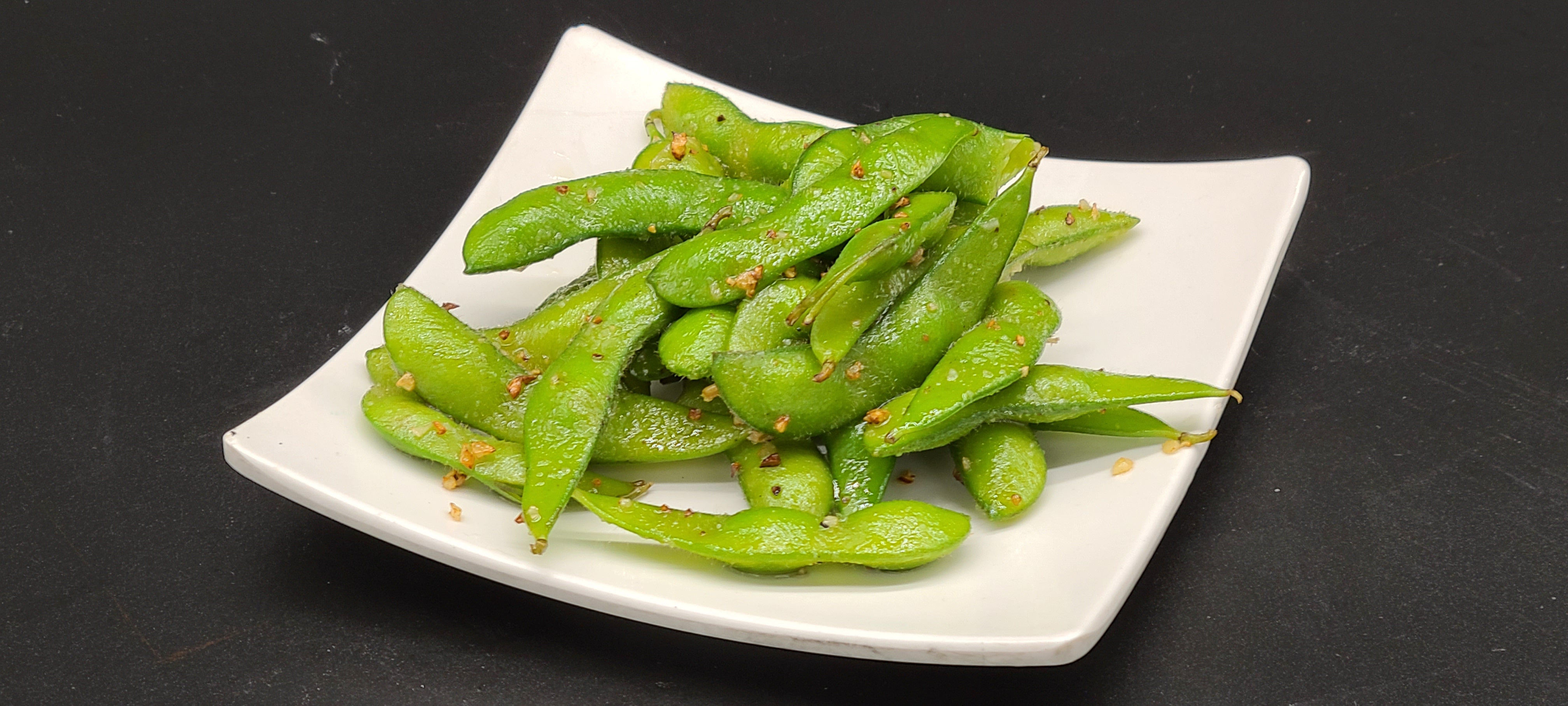Order A5. Garlic Butter Edamame food online from Hello Sushi store, Fullerton on bringmethat.com