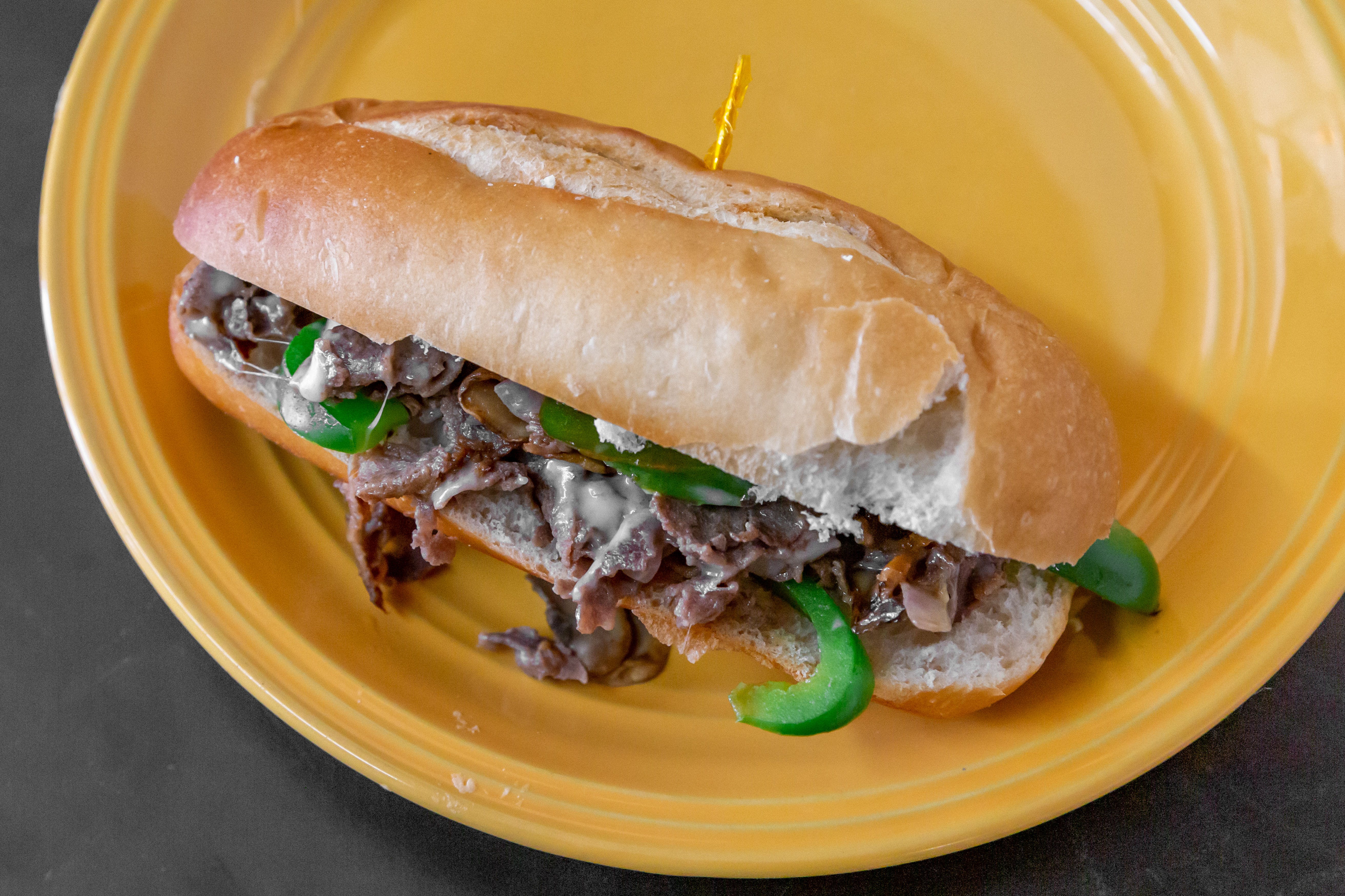 Order Philly Cheese Steak Deluxe Sub - 8" food online from New York Pizzeria & Catering store, Dobson on bringmethat.com