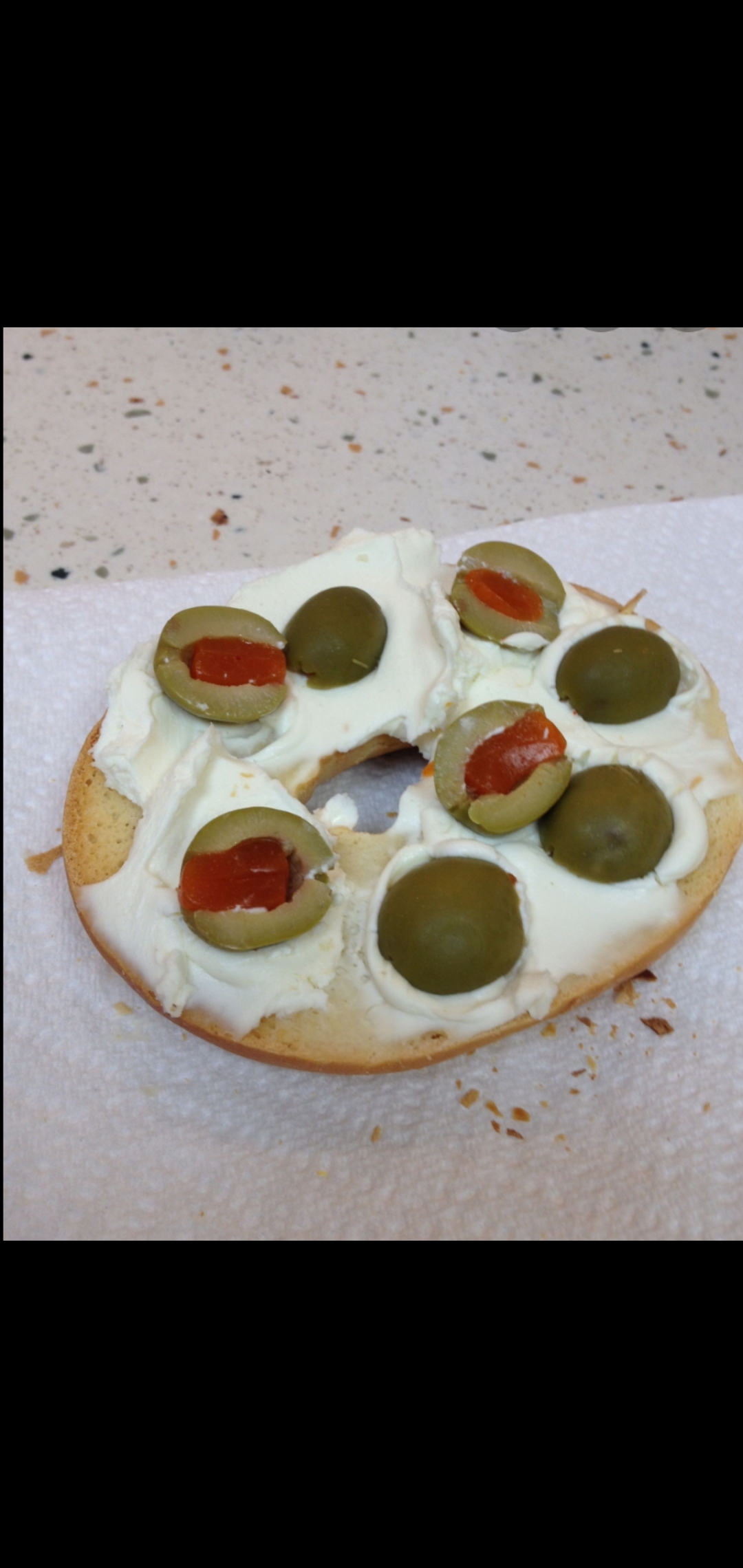 Order Bagel With Cream Cheese And Olives food online from American Gourmet Foods Deli store, New York on bringmethat.com