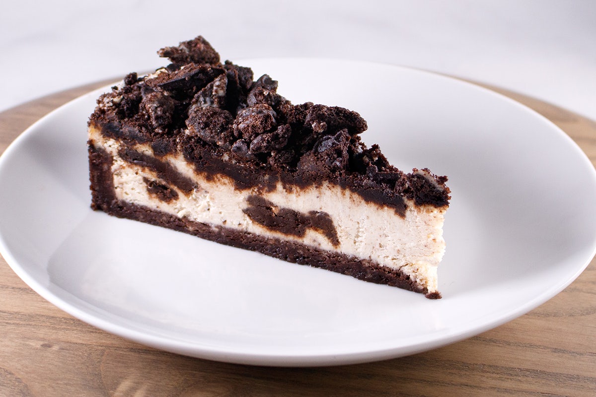 Order OREO® Cookie Cheesecake, slice food online from Perkins Restaurant & Bakery store, Cheyenne on bringmethat.com
