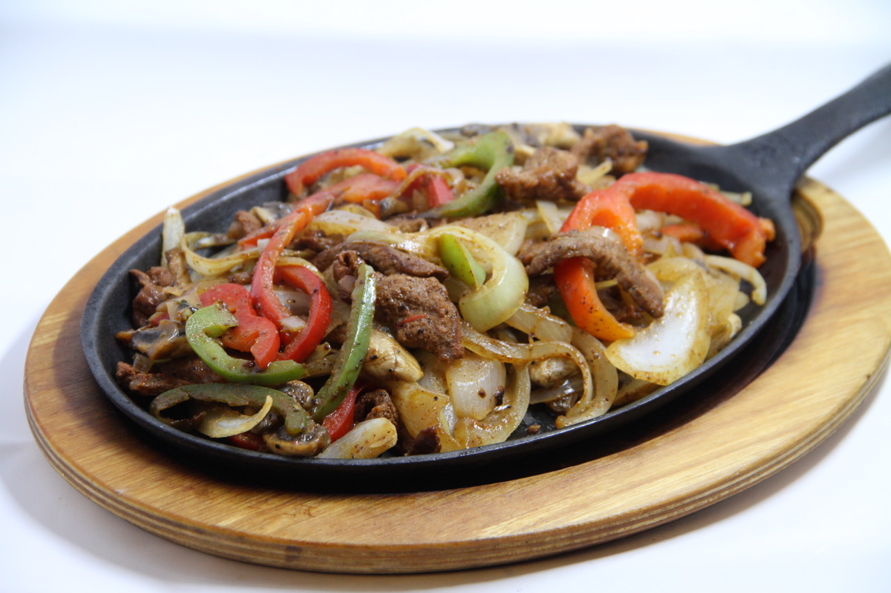 Order Sizzling Fajitas food online from Tulum Mexican Cuisine store, Seattle on bringmethat.com