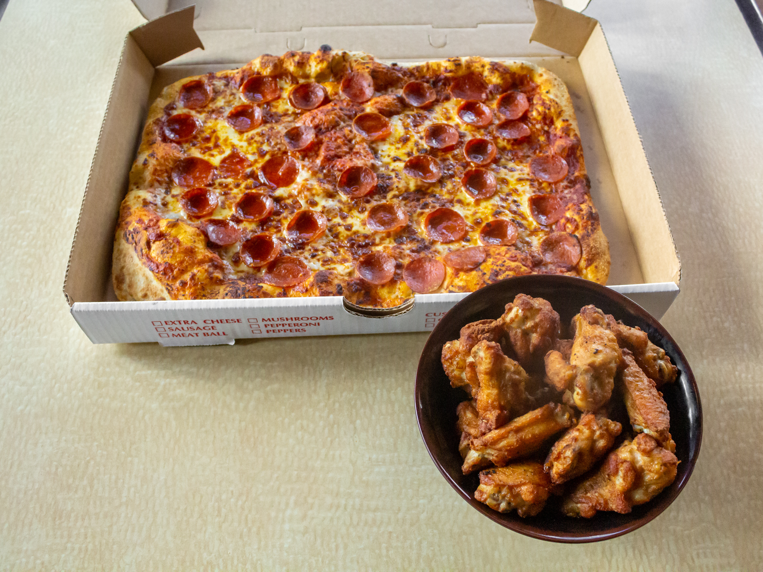 Order Half Sheet pizza (12-15 rectangle slices) and 20 bone in Wings food online from 1872 Cafe store, Rochester on bringmethat.com