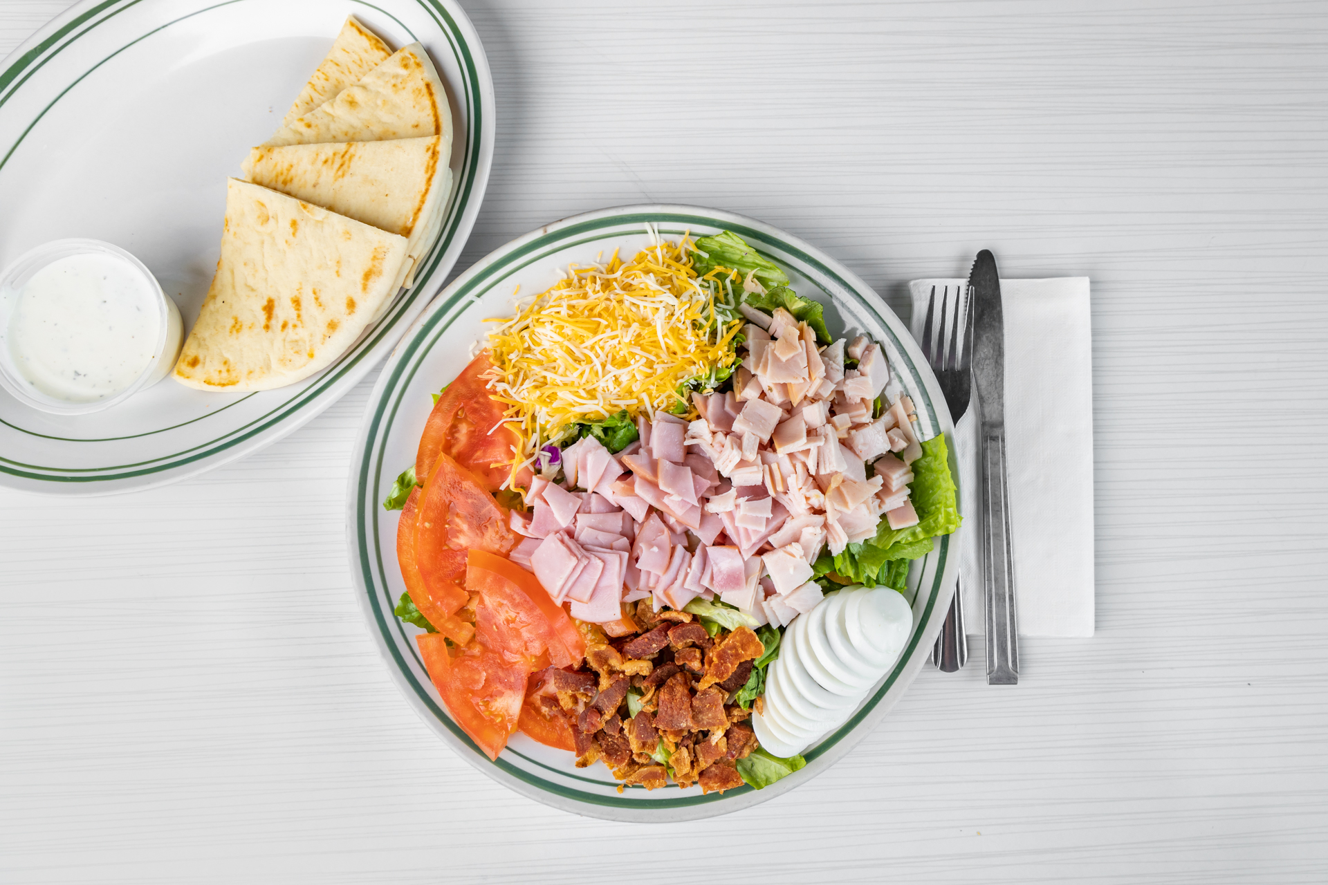 Order Cobb Salad food online from Goody Cafe store, Palm Desert on bringmethat.com