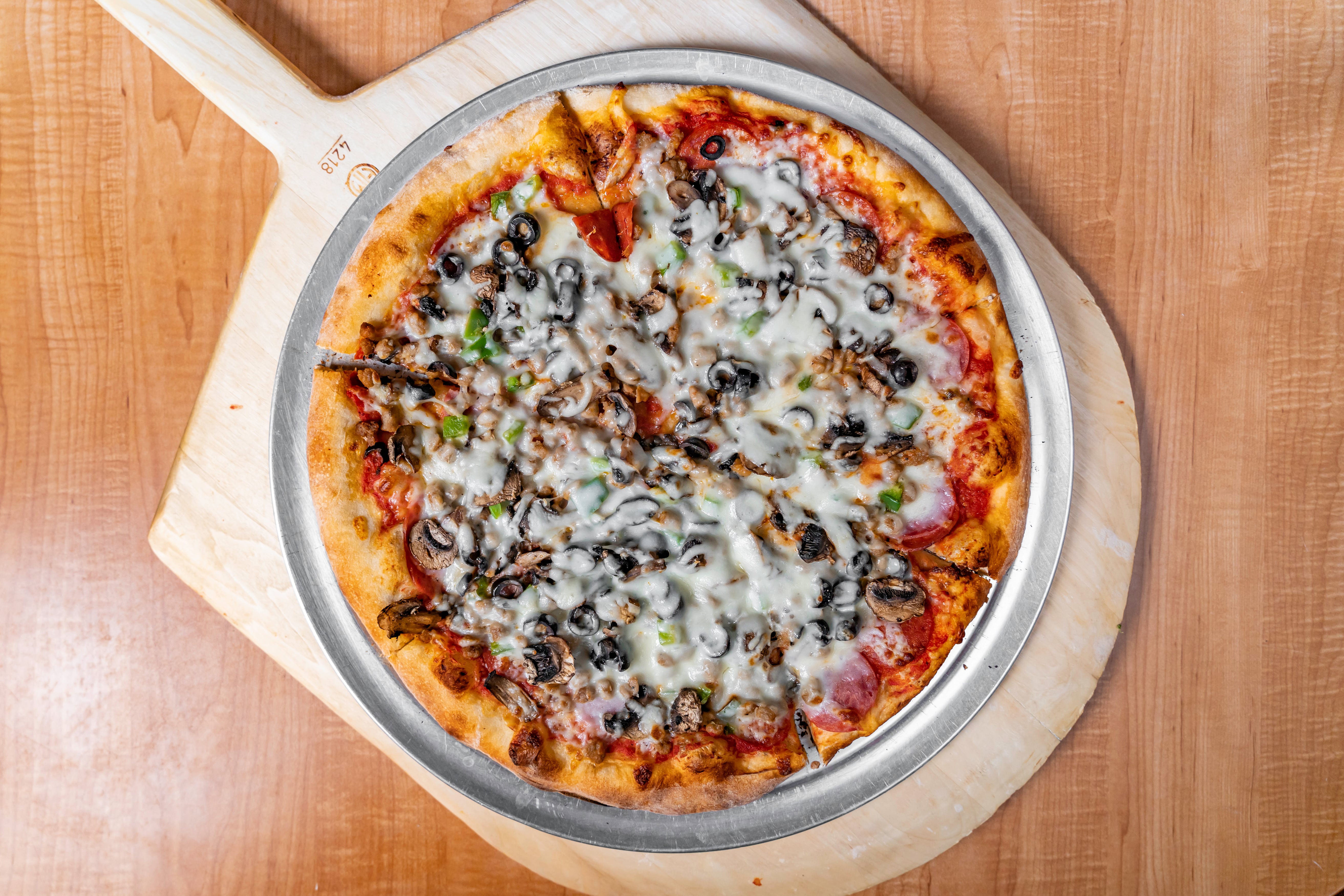 Order Supreme Pizza - Personal 10" food online from Luigi Italian Restaurant store, Hondo on bringmethat.com