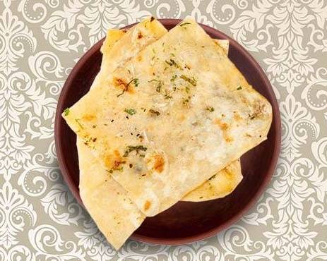 Order Garlic Naan food online from Eternal Clay Pot store, Chantilly on bringmethat.com