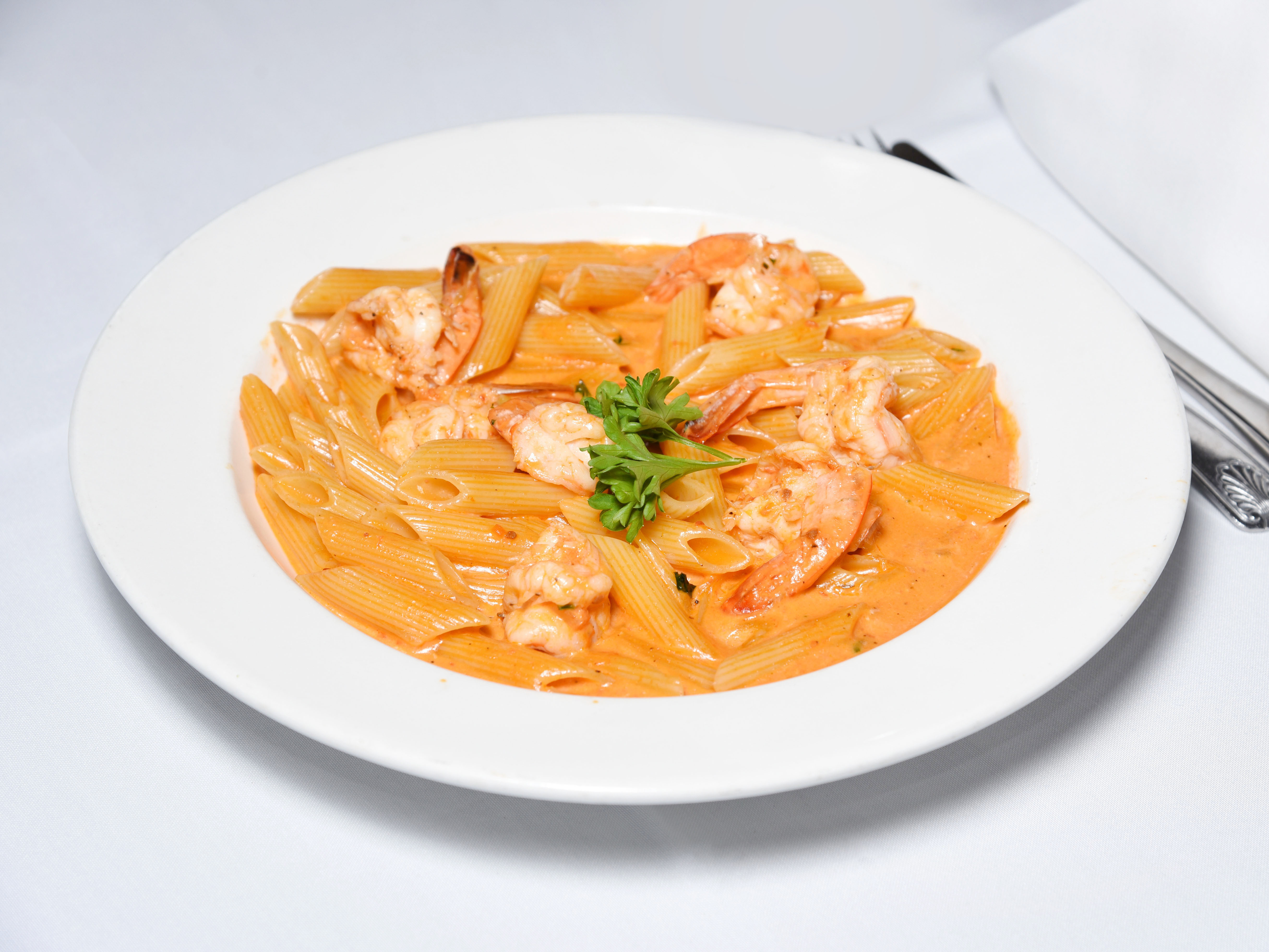 Order Penne Vodka* food online from Caridad and Louie Restaurant Corp store, Bronx on bringmethat.com