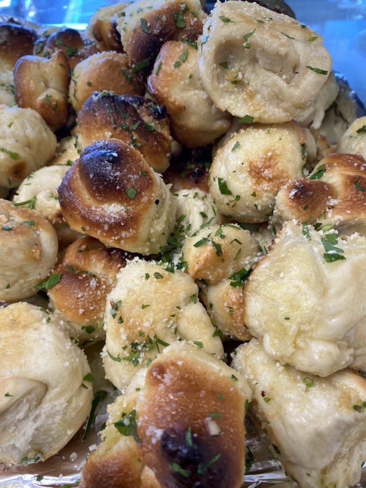 Order Garlic Knots - 6 Pieces food online from Oakhurst Pizza store, Oakhurst on bringmethat.com