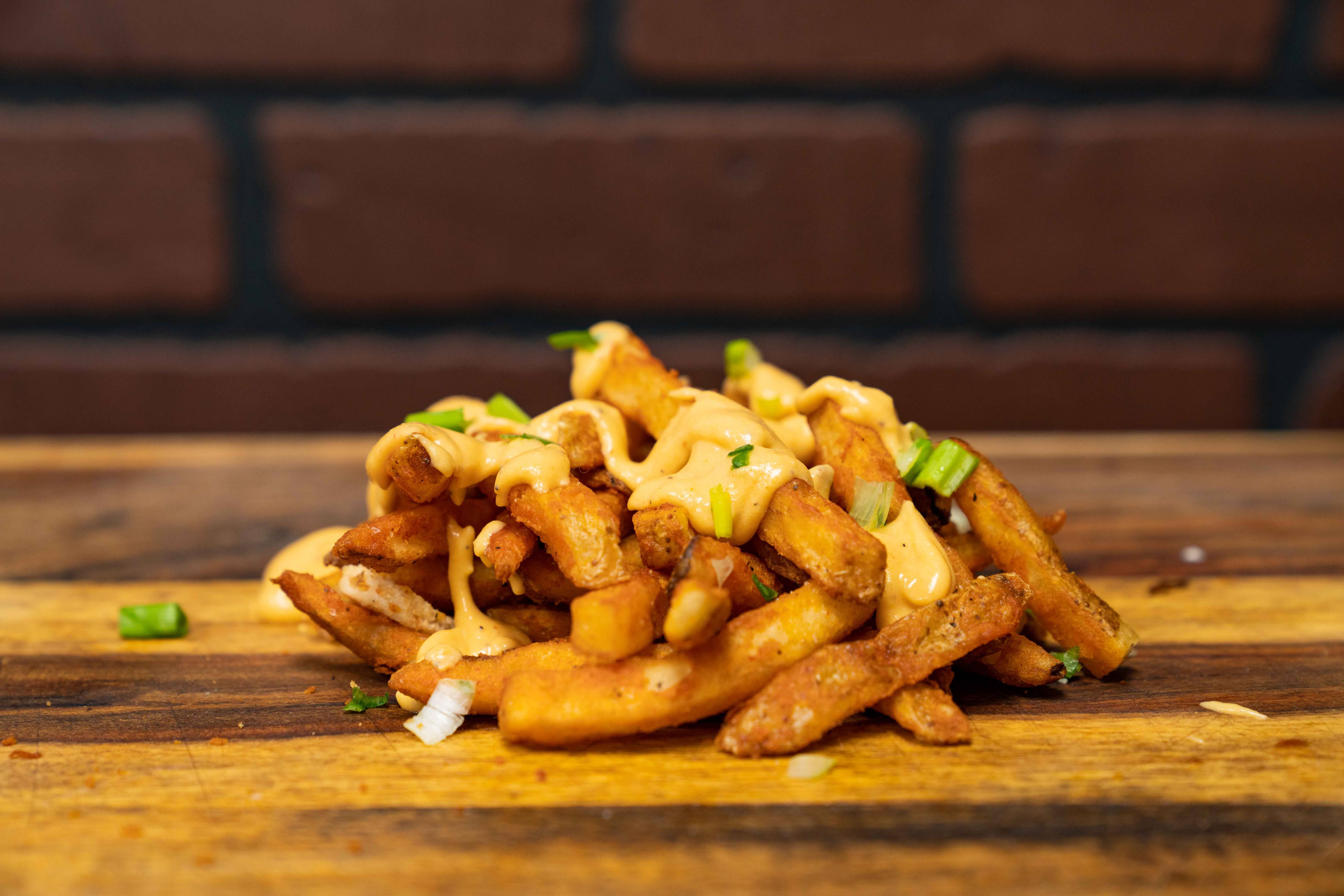 Order Fries and Queso food online from Big Belly Que store, Smithtown on bringmethat.com