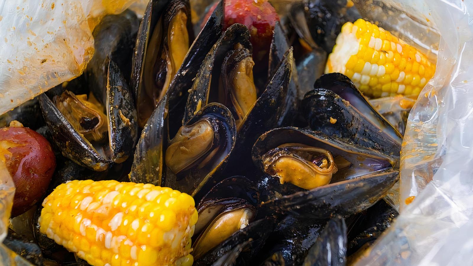 Order 1/2 lb Black Mussel  food online from Old Town Crab store, Lawrenceville on bringmethat.com