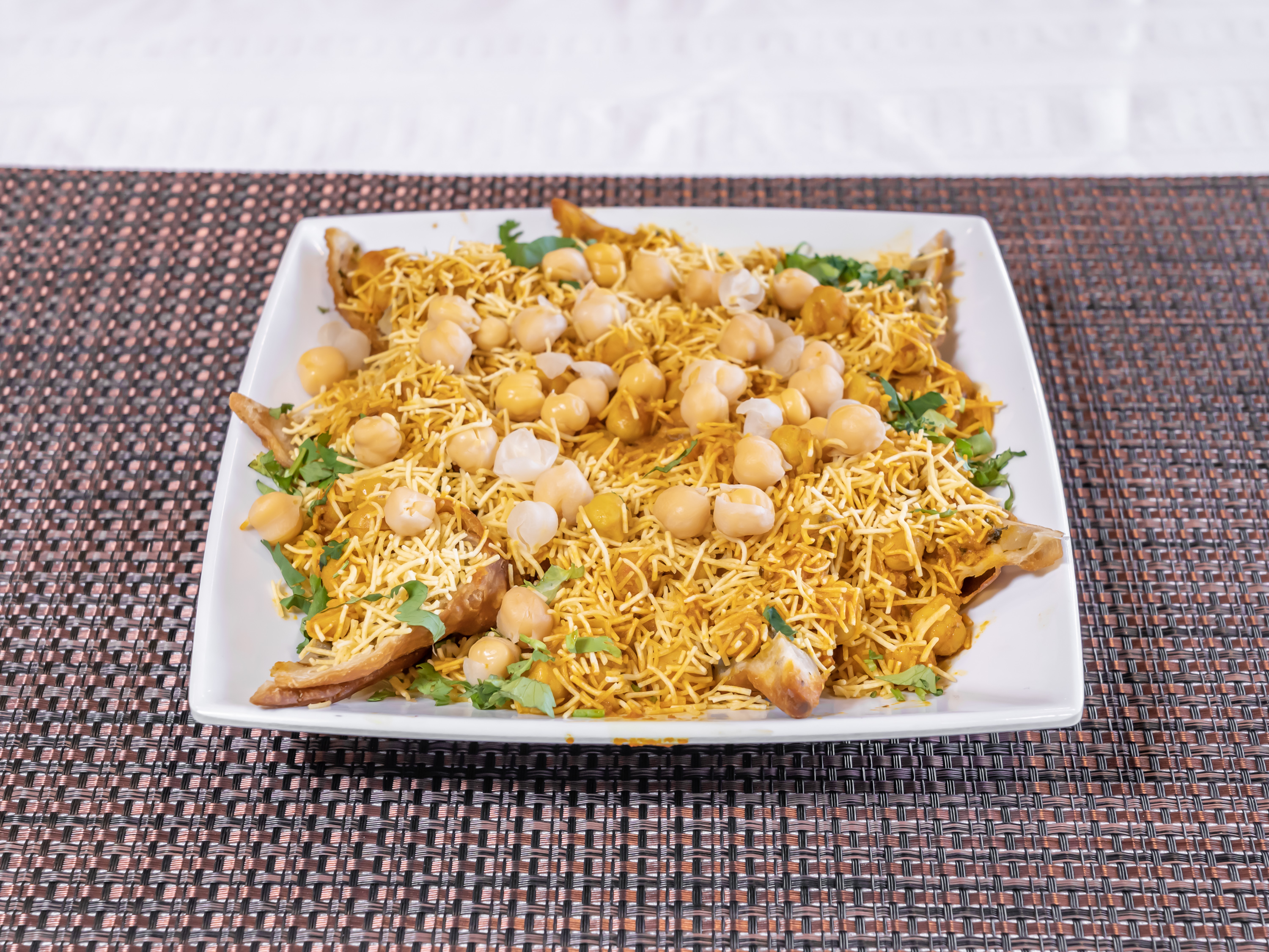 Order 18. Samosa Chaat food online from Charminar Biryani House store, Troy on bringmethat.com