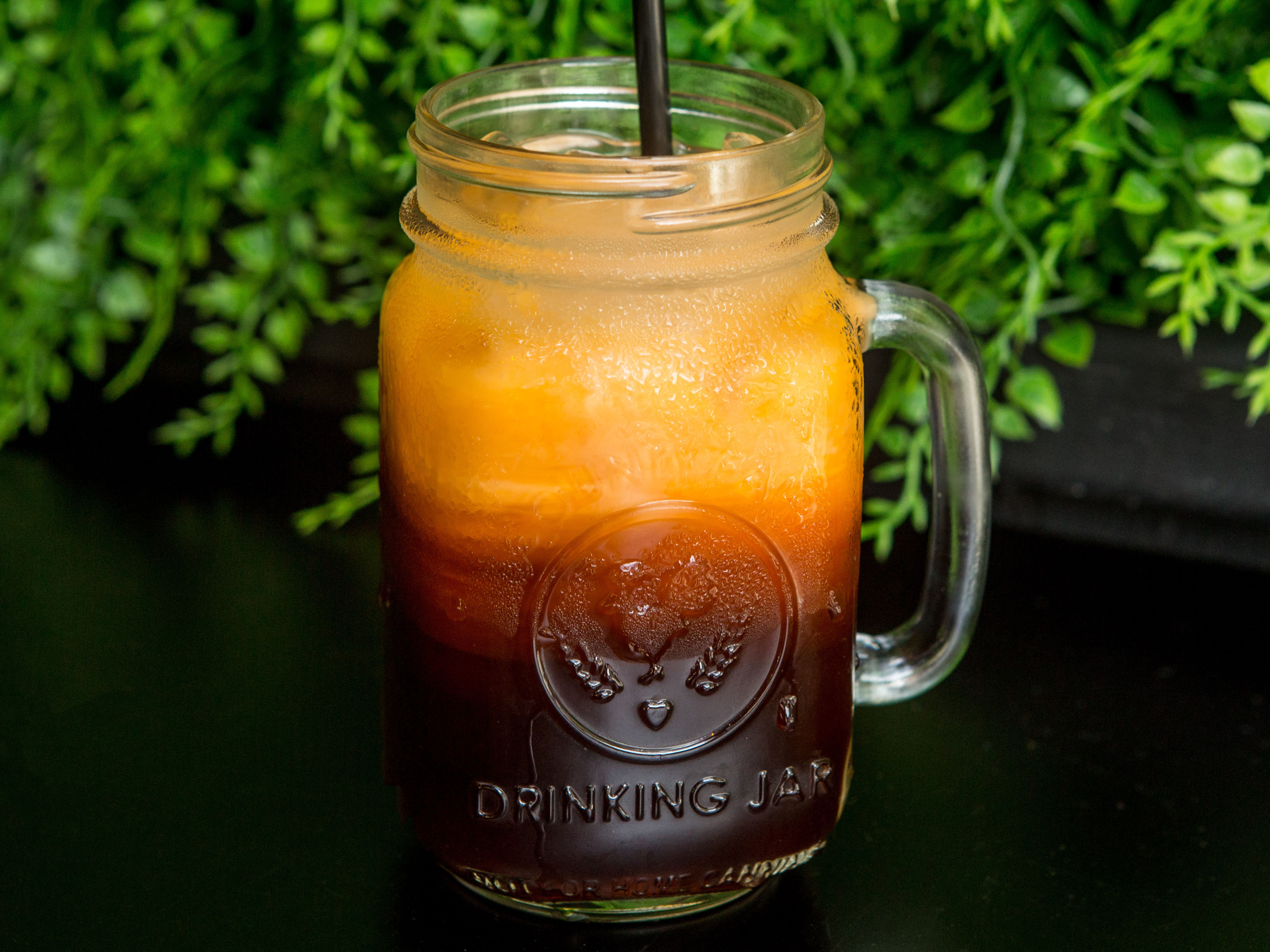 Order Thai Iced Tea with Milk food online from At Nine Restaurant & Bar store, New York on bringmethat.com