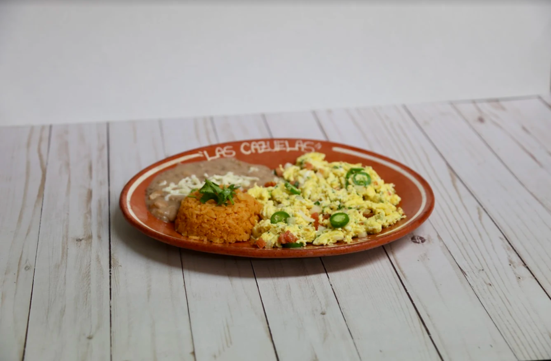 Order 41. Huevos a Ia Mexicana food online from Las Cazuelas Restaurant store, San Jose on bringmethat.com