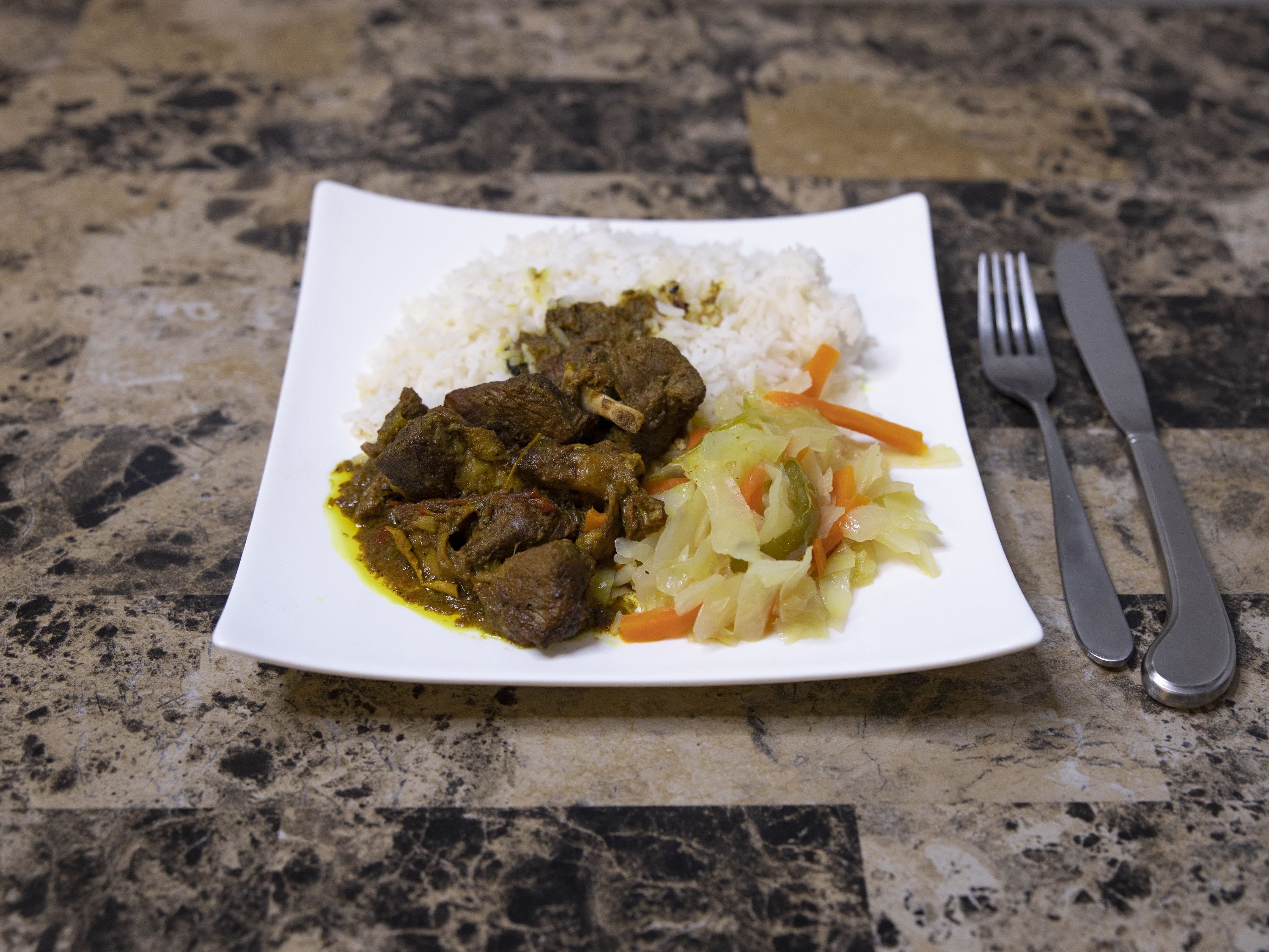 Order Curried Goat Dish  food online from Negril Caribbean Restaurant store, Wilmington on bringmethat.com