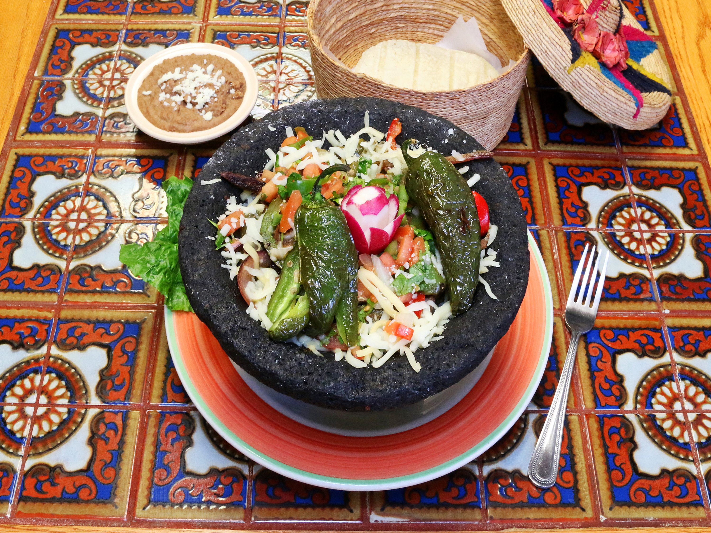 Order Molcajete the Volcano food online from Tia Wanna's store, Aurora on bringmethat.com