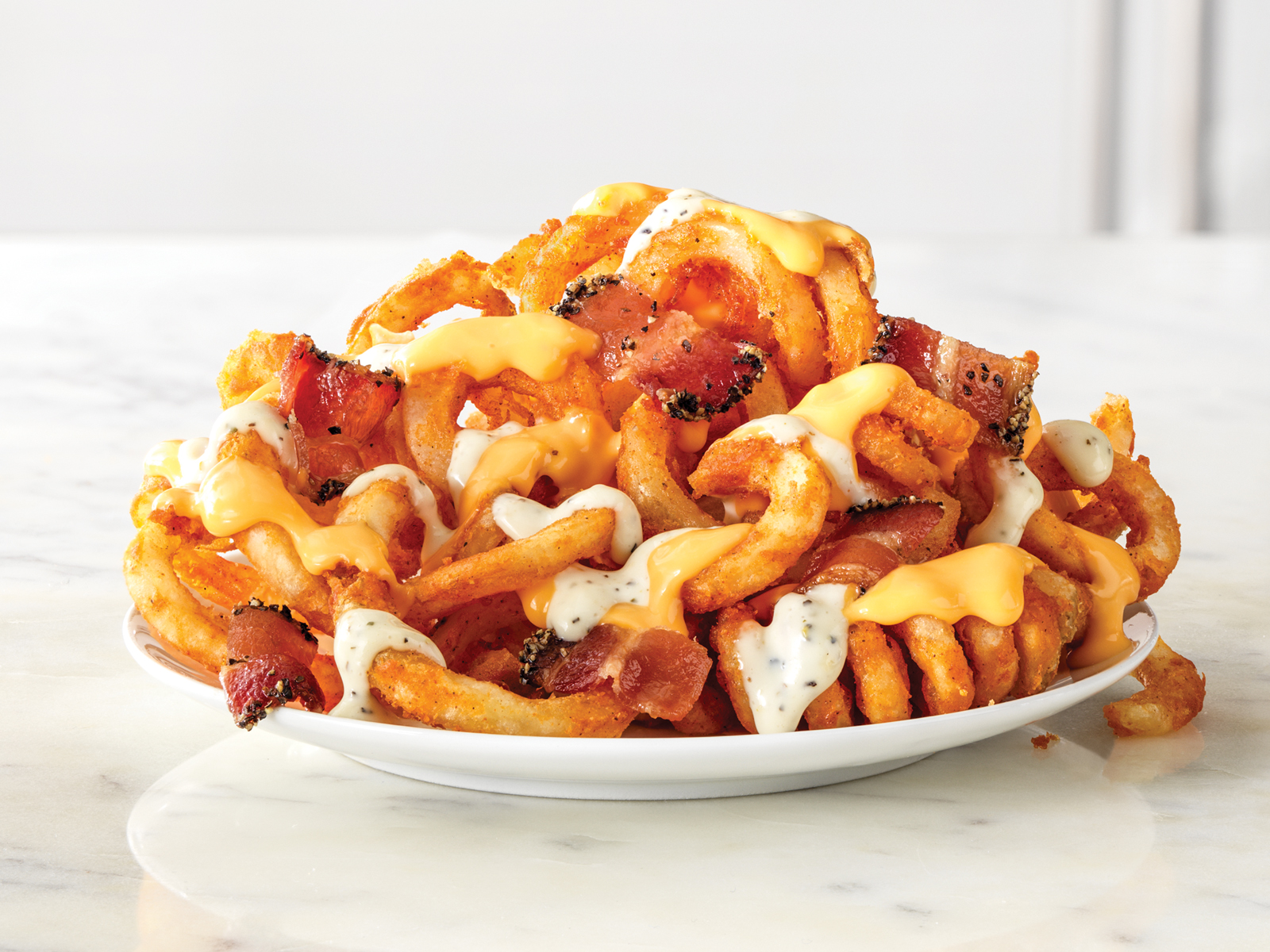 Order Loaded Curly Fries food online from Arby store, Azle on bringmethat.com