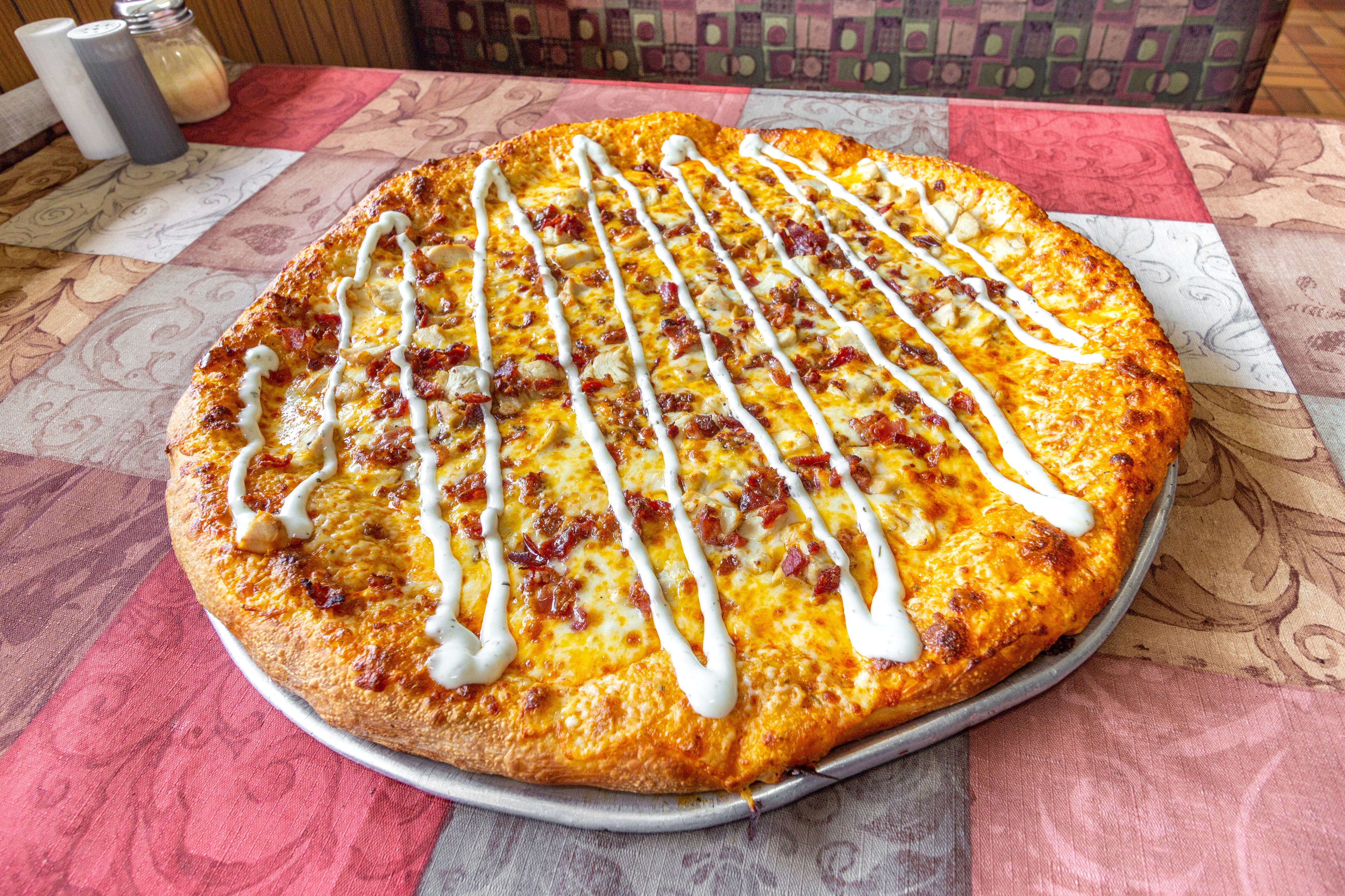 Order Chick-N- Bacon Ranch Pizza - 1/4 pie 2 slices food online from Chick-N-Pizza Works store, Buffalo on bringmethat.com