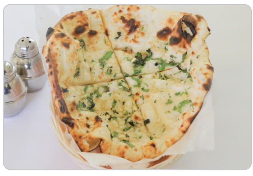 Order Garlic Naan food online from Rangla Punjab Indian Cuisine store, Arlington on bringmethat.com