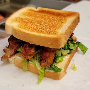 Order B.L.T. ON White Toast (3 STRIPS) food online from Steak In A Sack store, Fort Washington on bringmethat.com